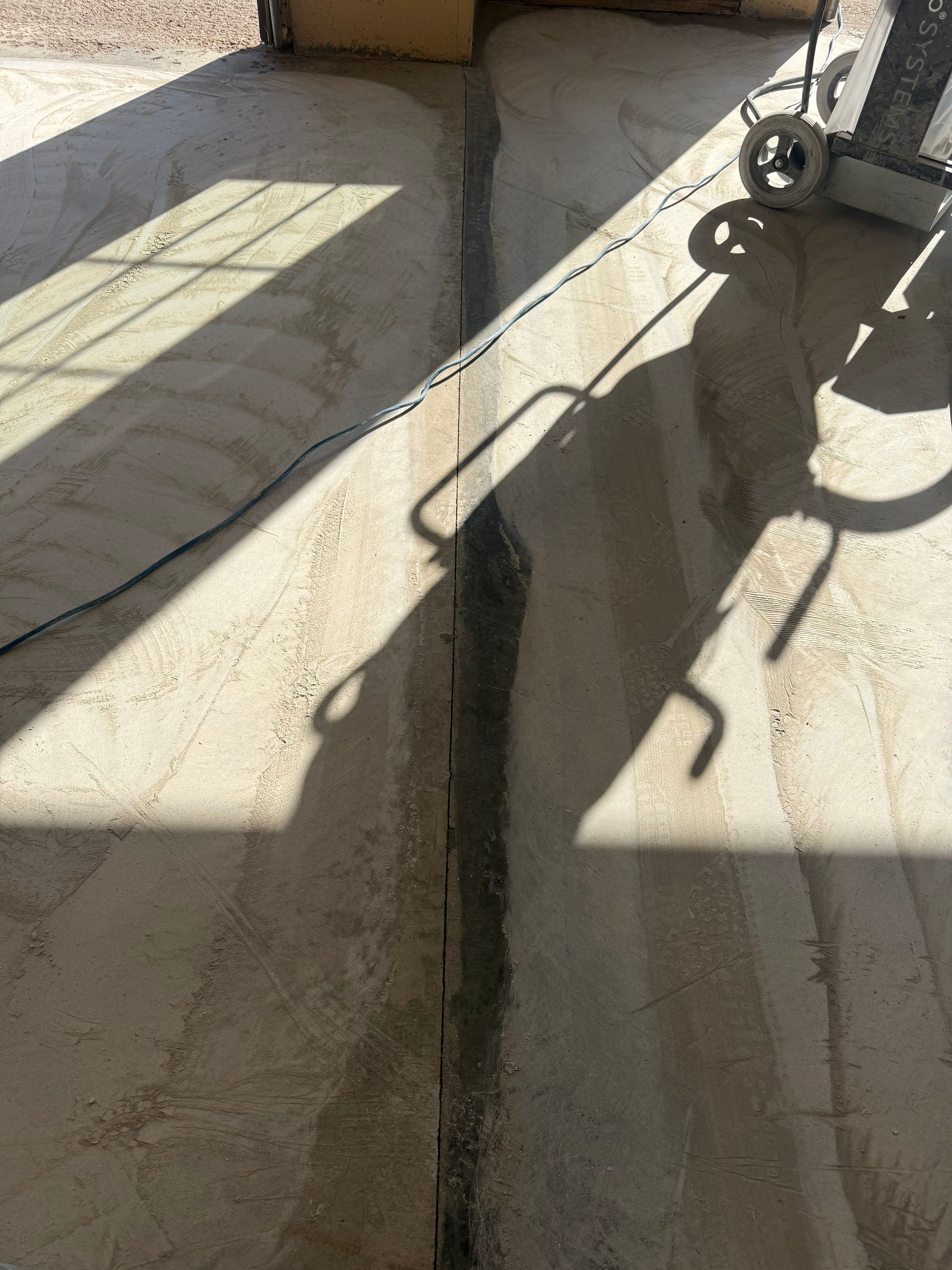 Residential Garage Floor Transformation with Speckled Epoxy Coating by Select Painting, Coatings & Garage Cabinets