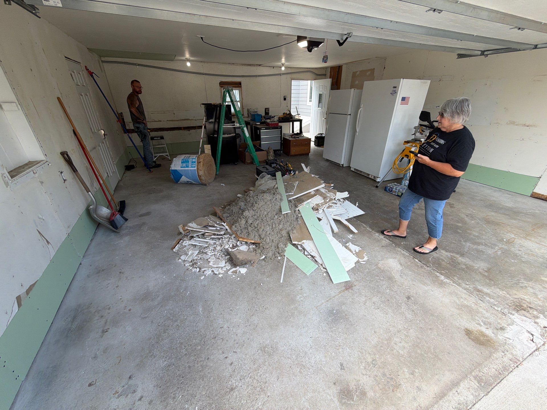 Custom Garage Floor Coating and Backyard Patio Refinishing in Tyndall by Select Painting, Coatings & Garage Cabinets
