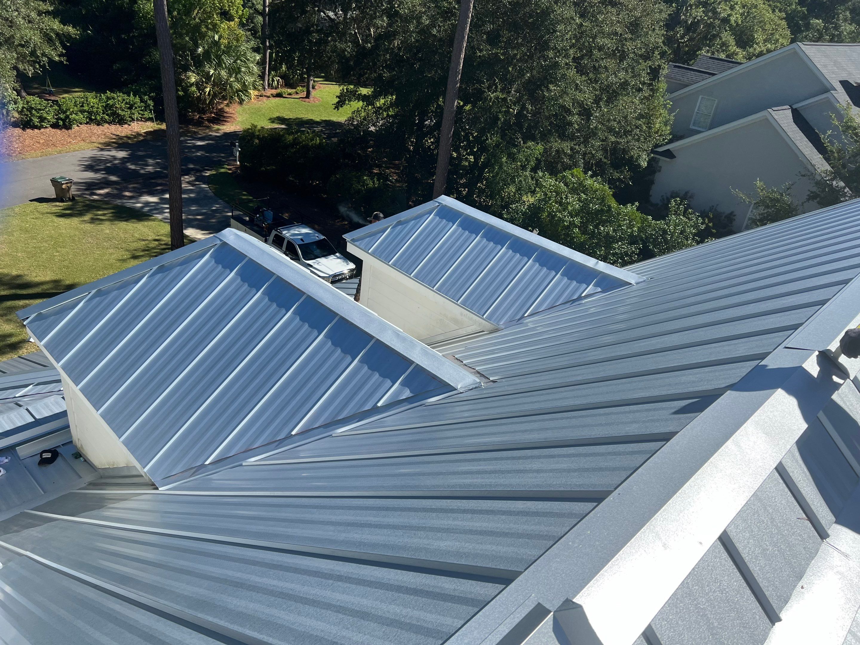 Roof Replacement using Standing Seam Metal by Rainstoppers Roofing