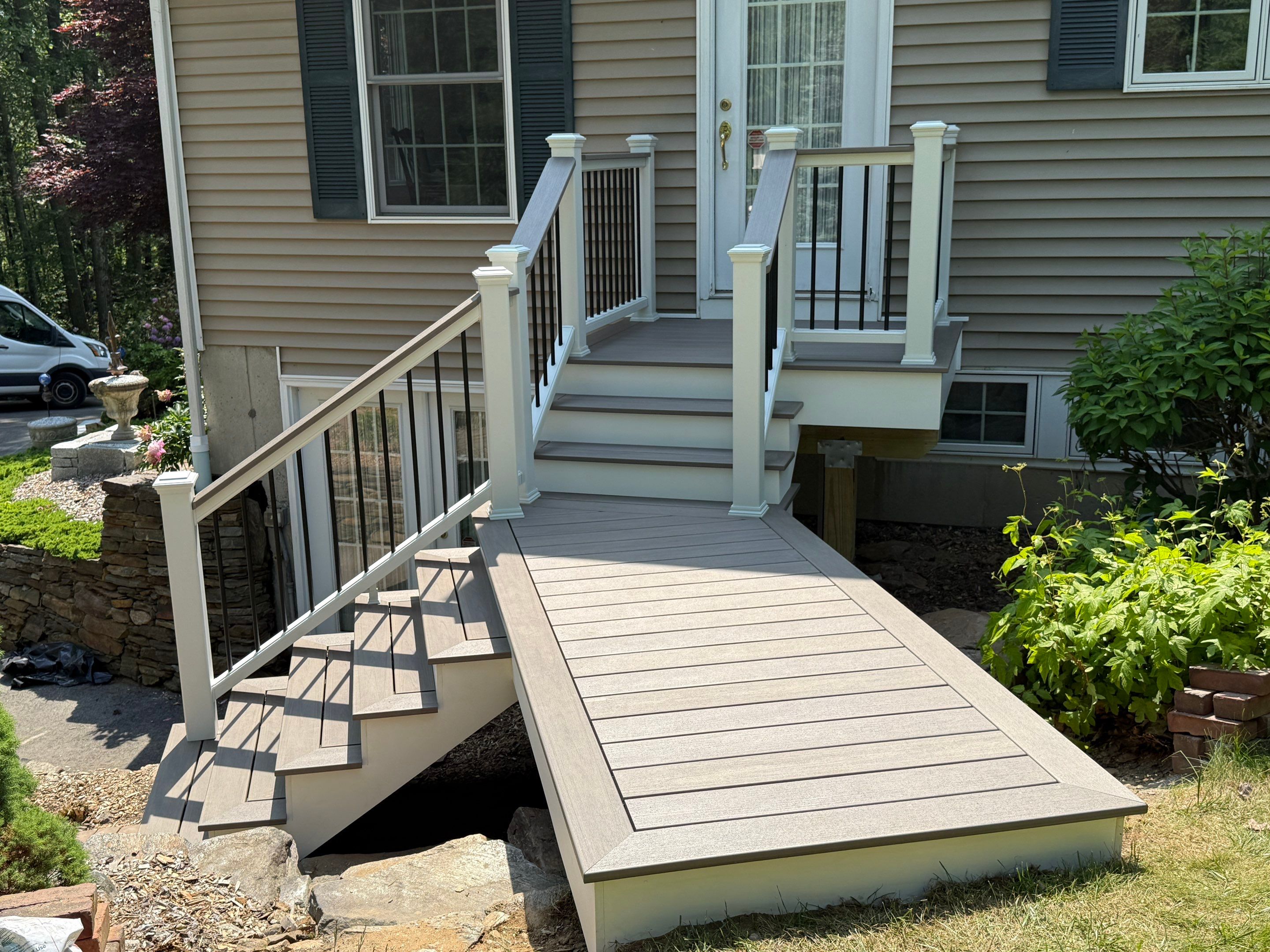 Front Porch Replacement with Trex Lineage Biscayne and Trex Cocktail railing. by DiGiorgi Roofing and Siding Inc