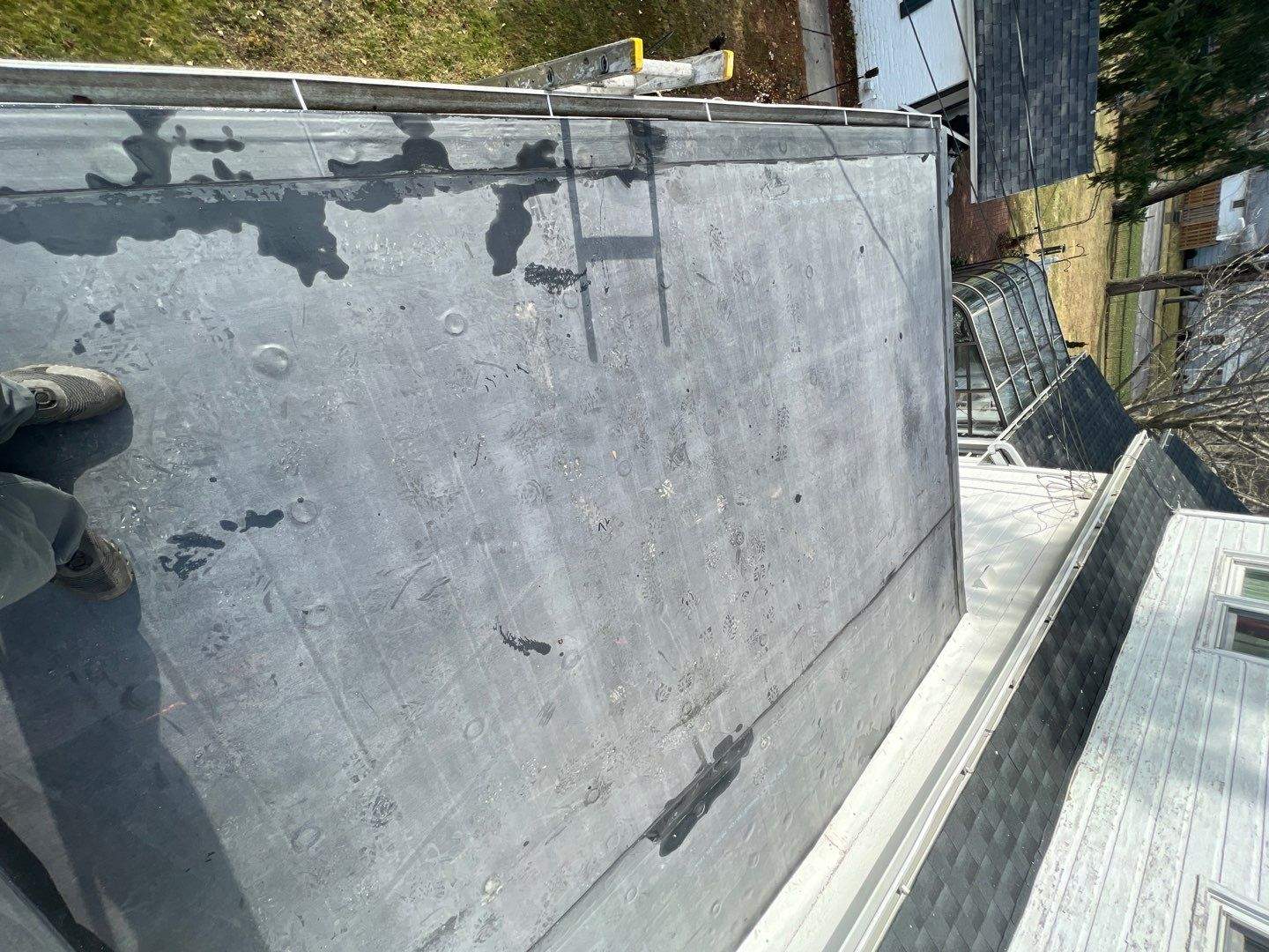 Residential Roofing Installation using 60 mil rubber roof by Nitro Roofing and Construction