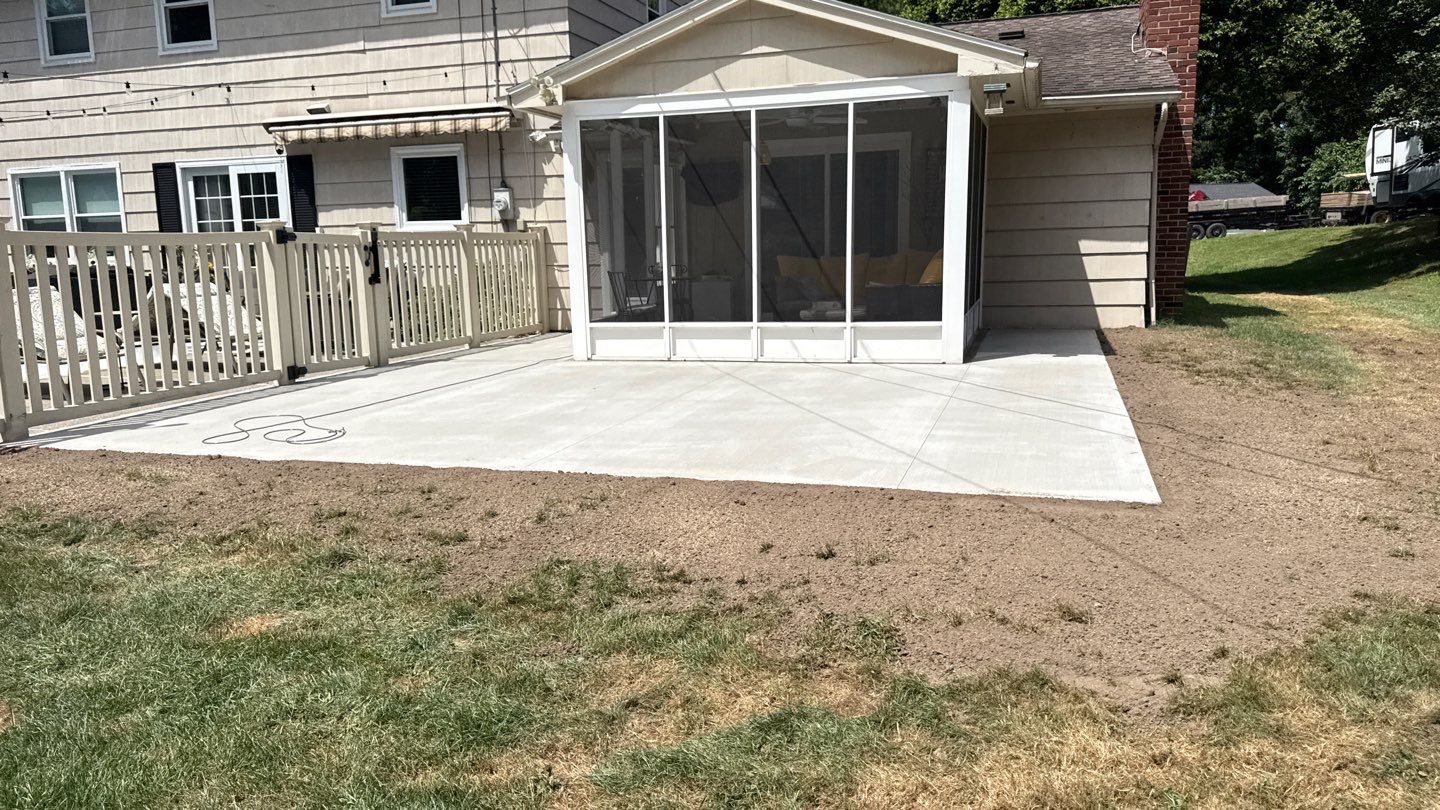 Broom finished concrete patio and sidewalk  by NG Masonry & Construction LLC