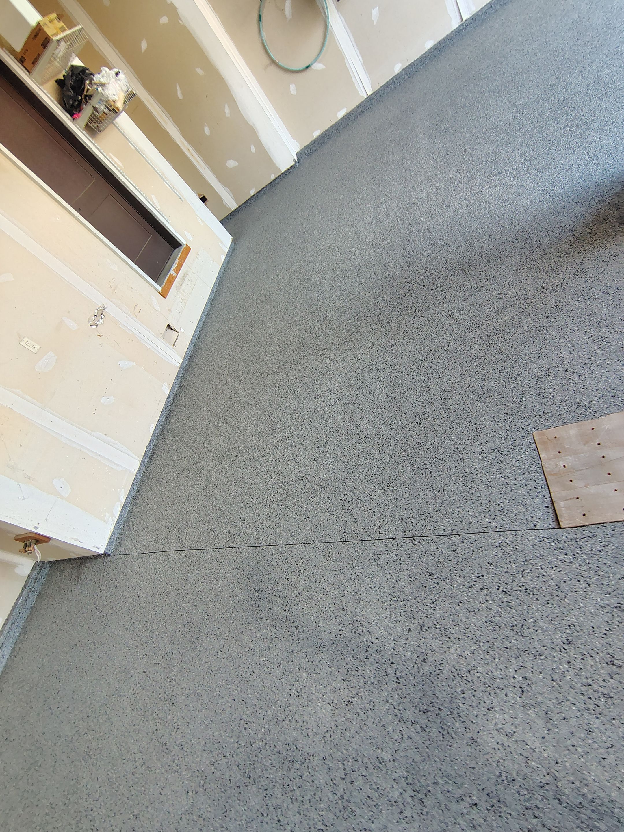 Sioux Falls Garage Concrete Grinding and Nightfall Decorative Chip Coating by Select Painting, Coatings & Garage Cabinets
