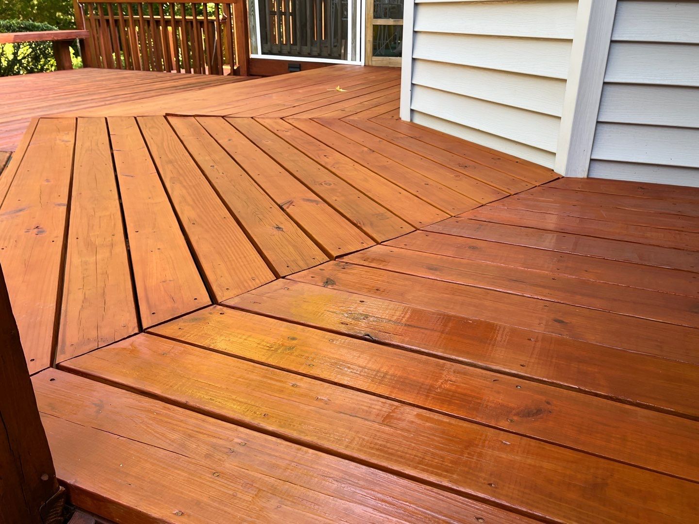 Triple deck re-staining by AKK Painting LLC