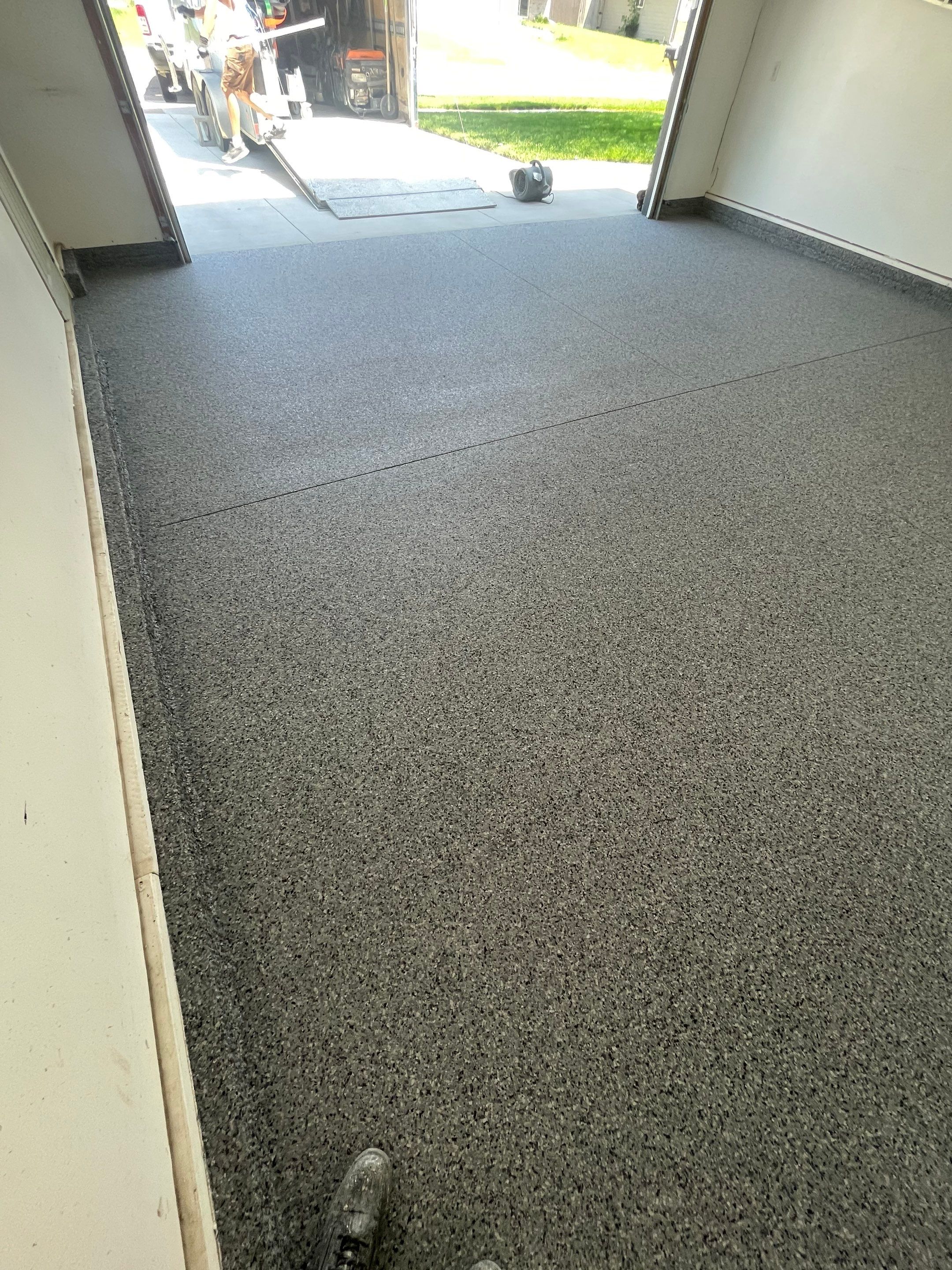 Sioux Falls Garage Floor Coating with Nightfall Decorative Chips by Select Painting, Coatings & Garage Cabinets