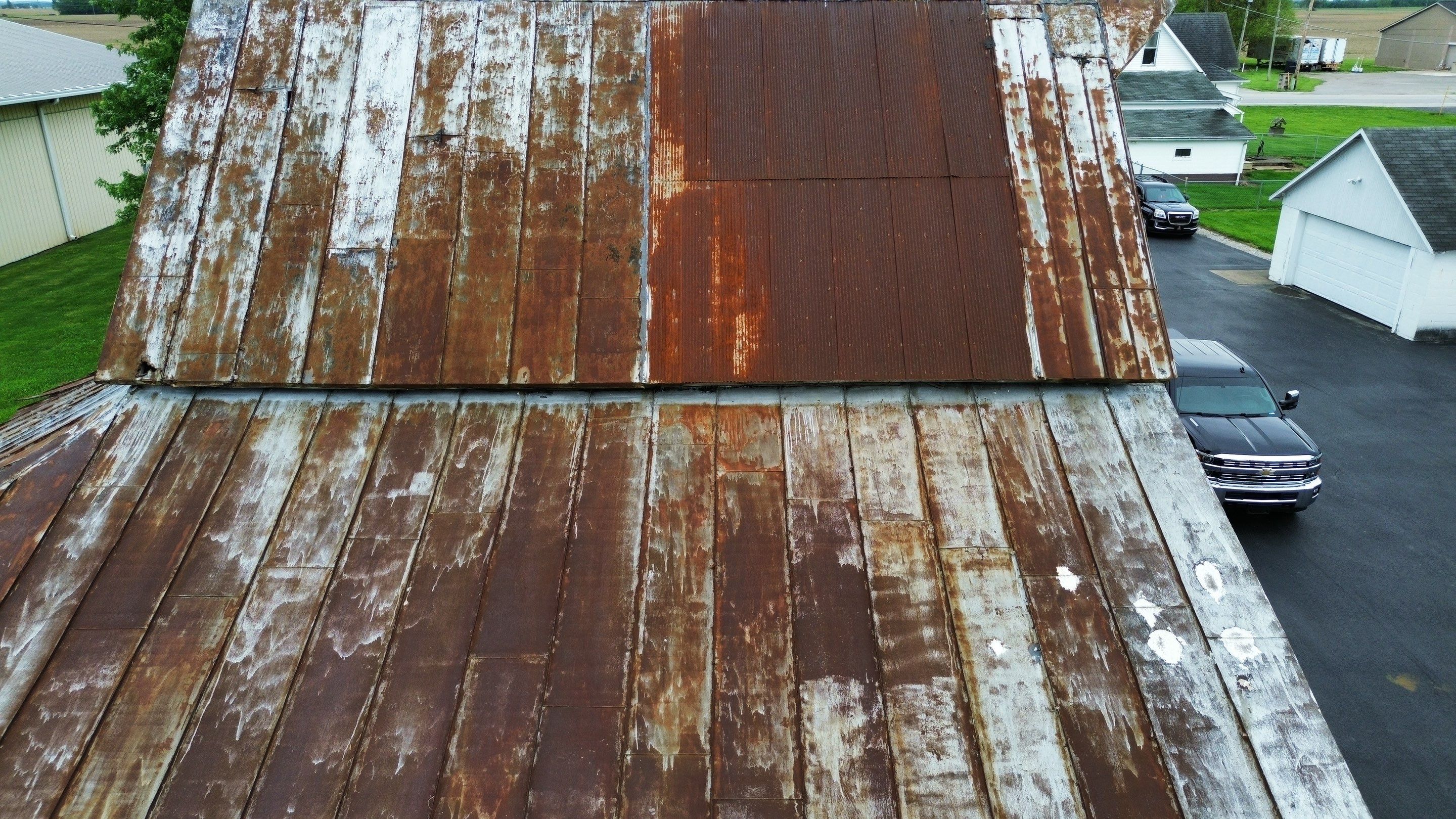 Residential Roofing Installation using Standing Seam Metal - Barn Red by RoofX 