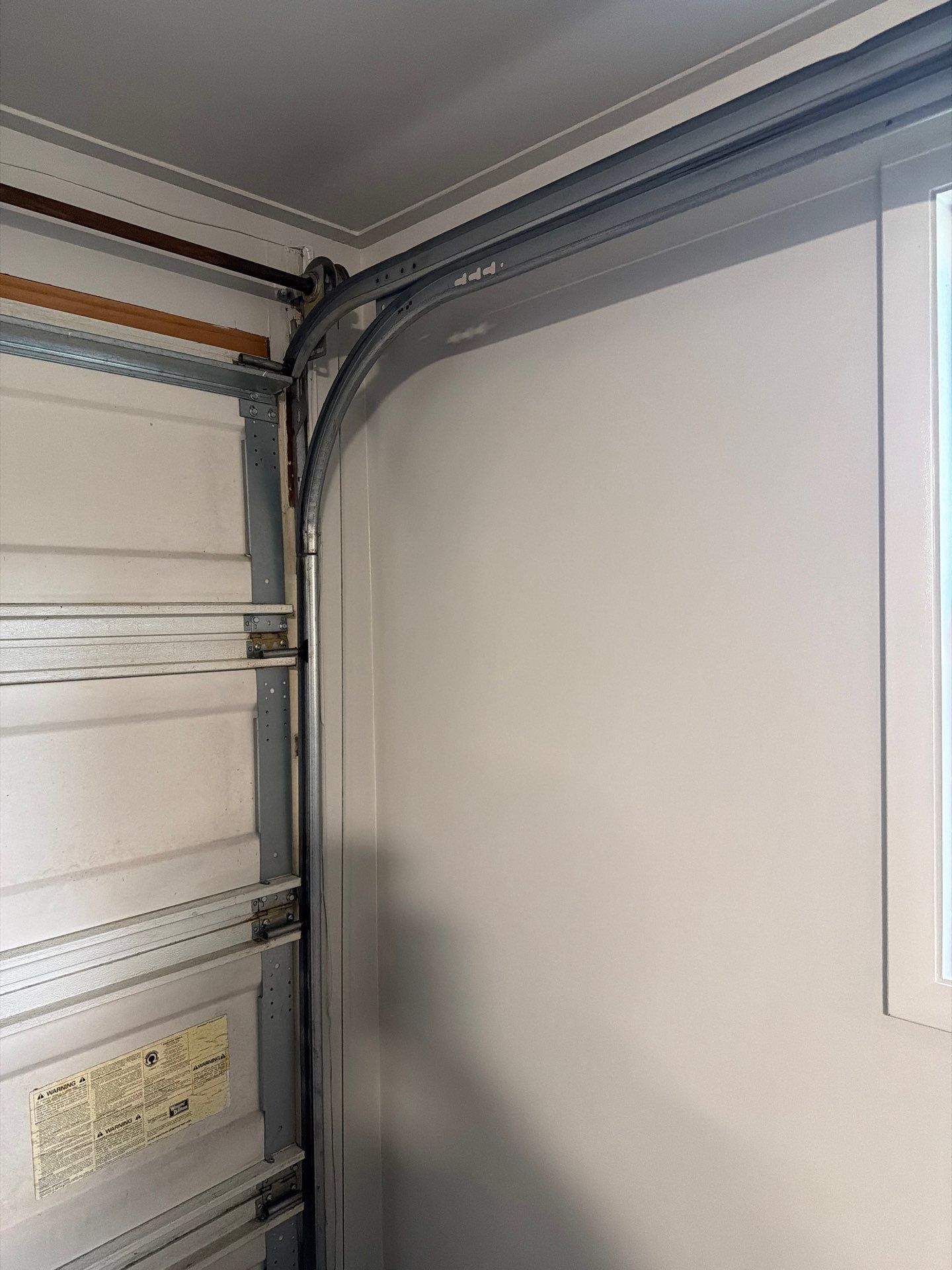 Muskegon Garage Interior Painting and Epoxy Flake Floor Installation by Gordon Painting