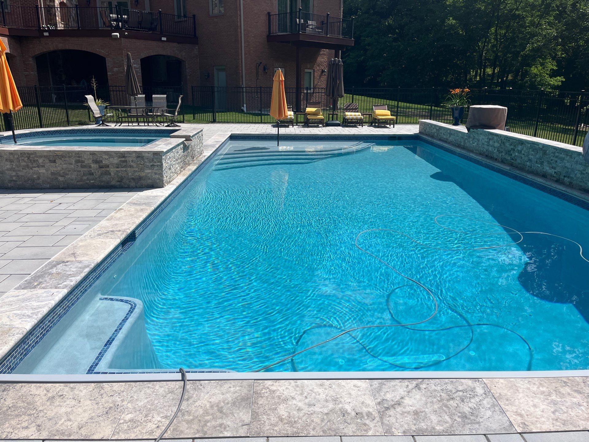 Gunite Pool w/ Spa and Water Features  by Elysium Pools