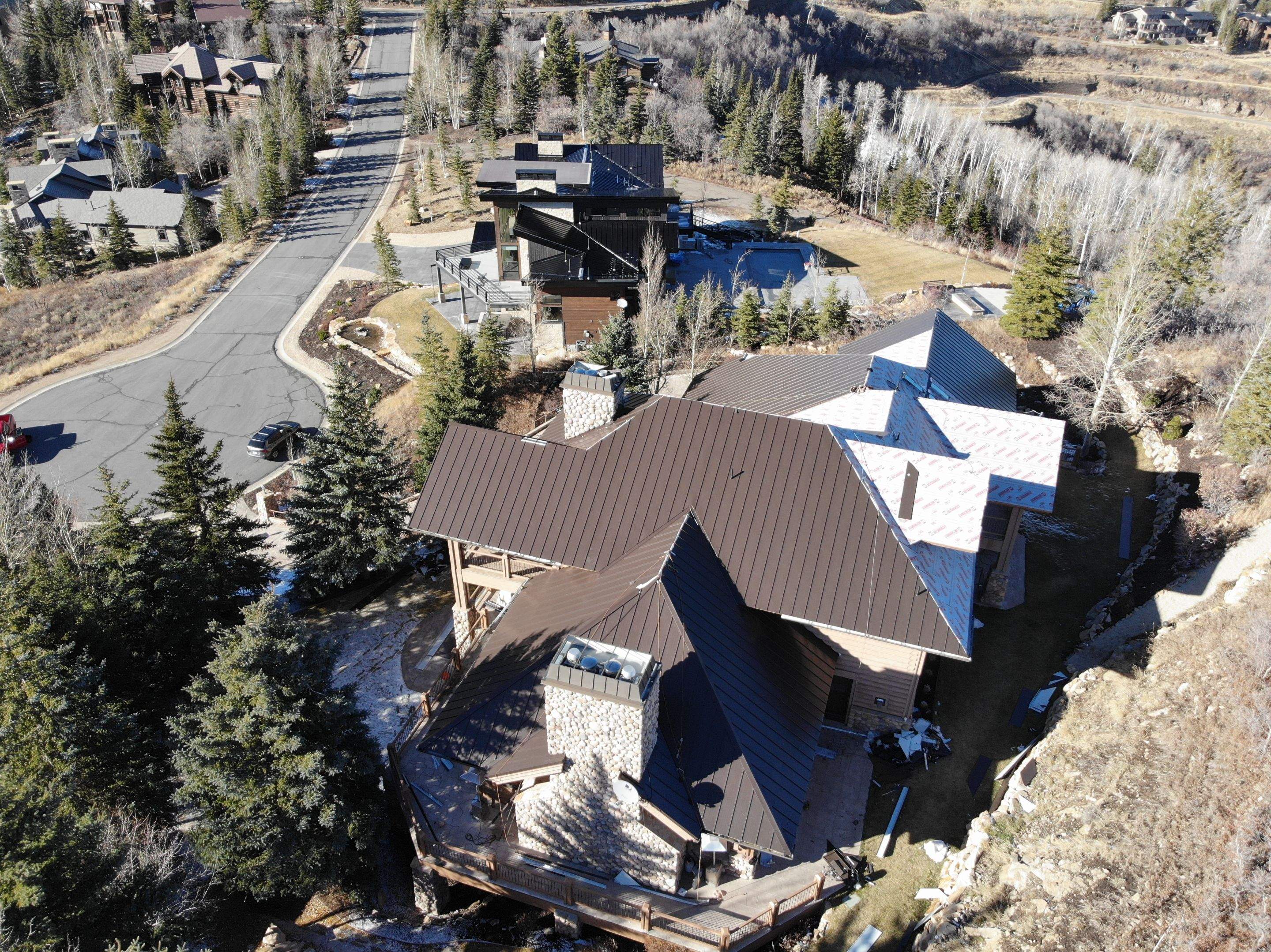 Standing Seam Metal Roof Replacement After Snow Damage by ASAP Roofing & Restoration