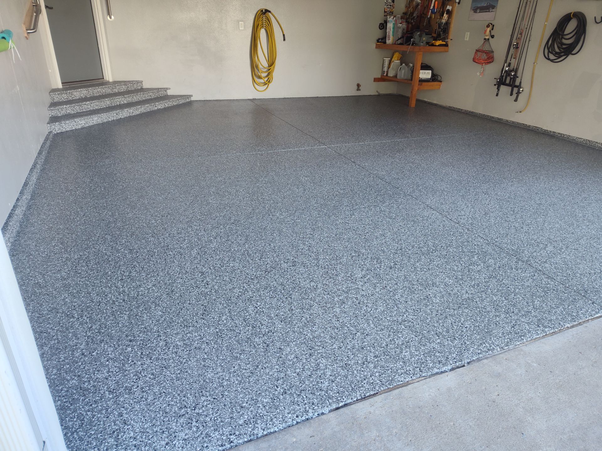 Close Up View of This Customer's New Flake Coating by Revival Concrete Coatings