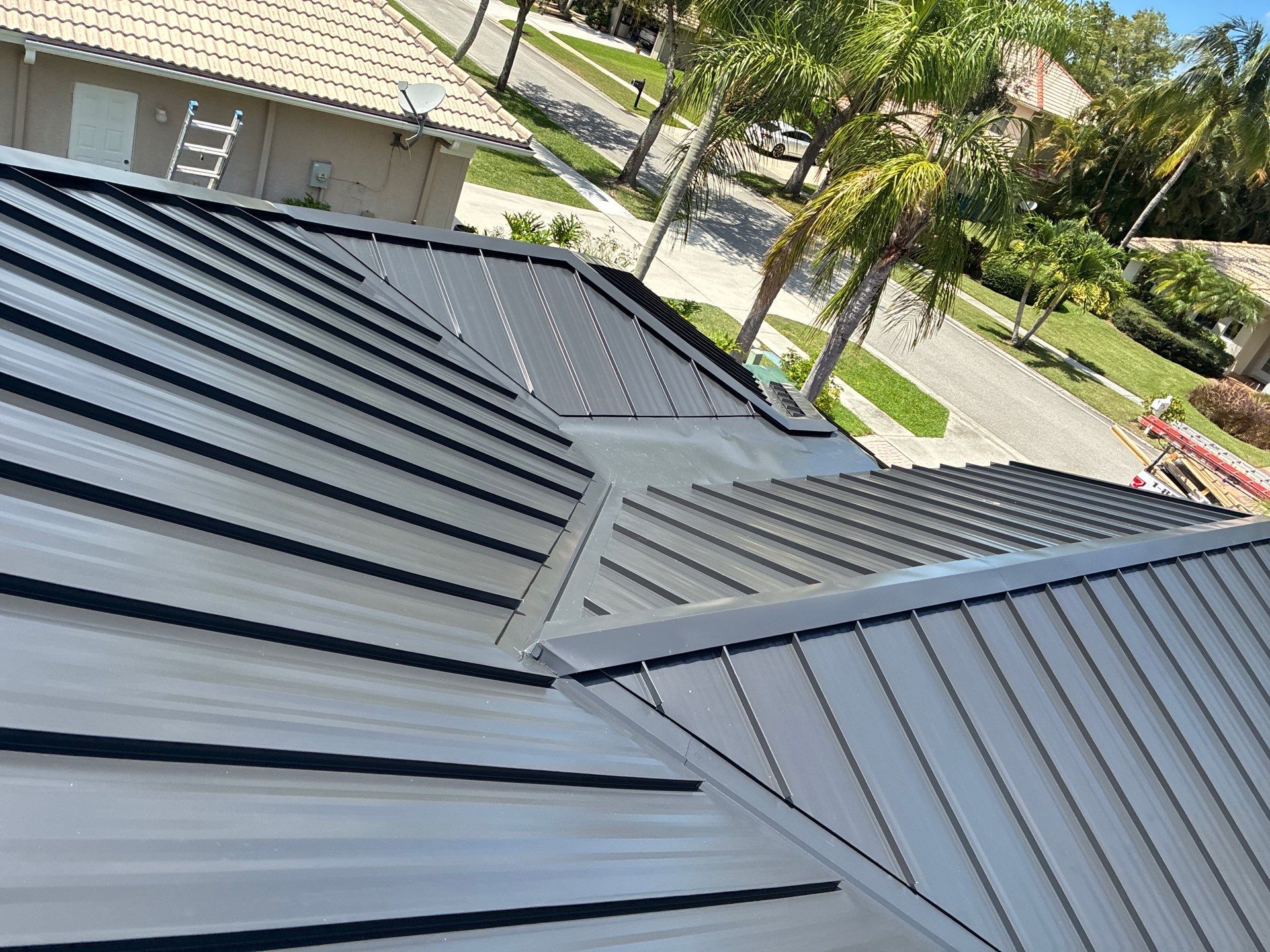 24ga 1.5" Mechanical Seam Matte Black by Total Roofing System The Metal Roof Experts