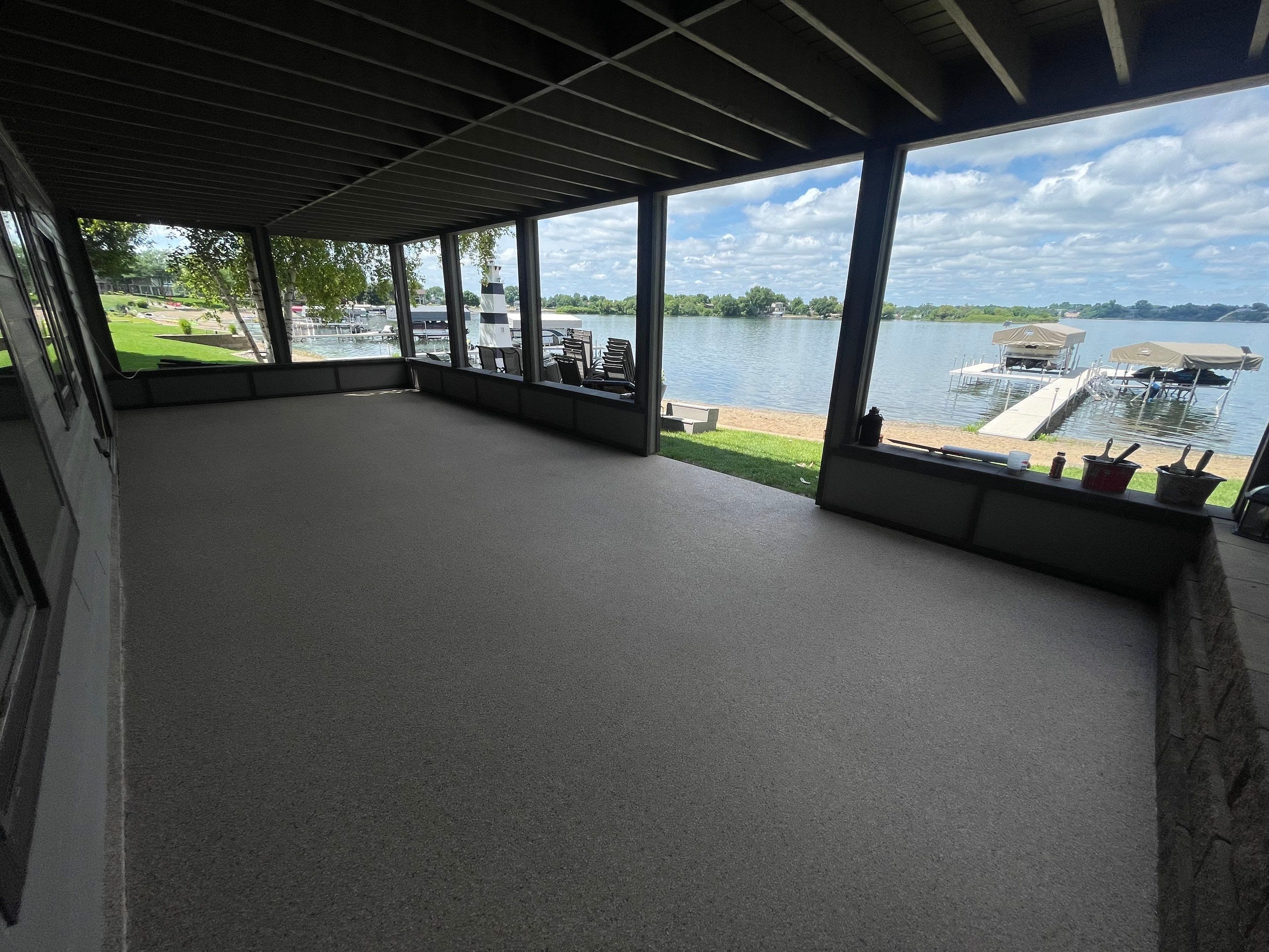 Lakefront Screened Patio Concrete Coating Installation in Wentworth by Select Painting, Coatings & Garage Cabinets