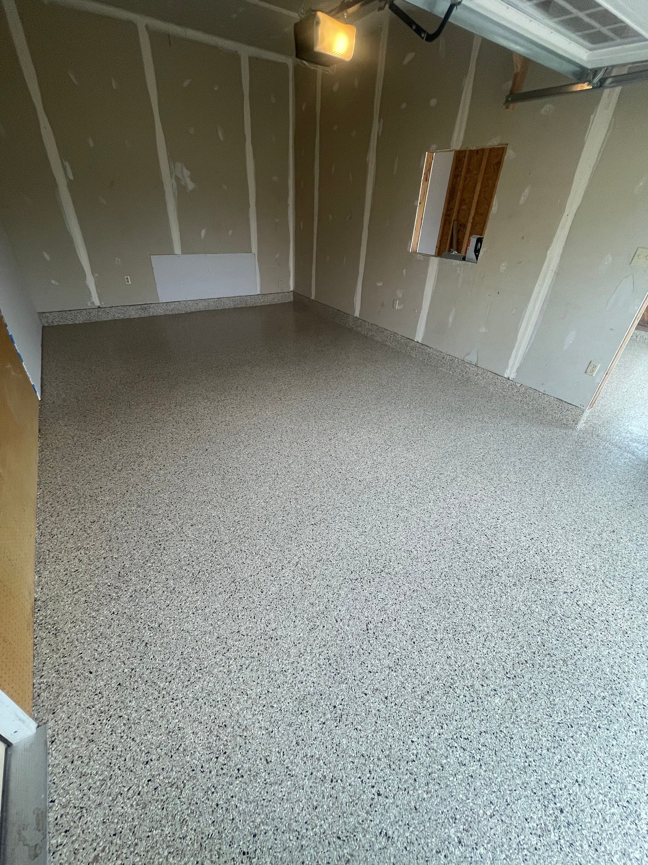 Speckled Epoxy Floor Coating Installation for Centerville Residential Garage by Select Painting, Coatings & Garage Cabinets