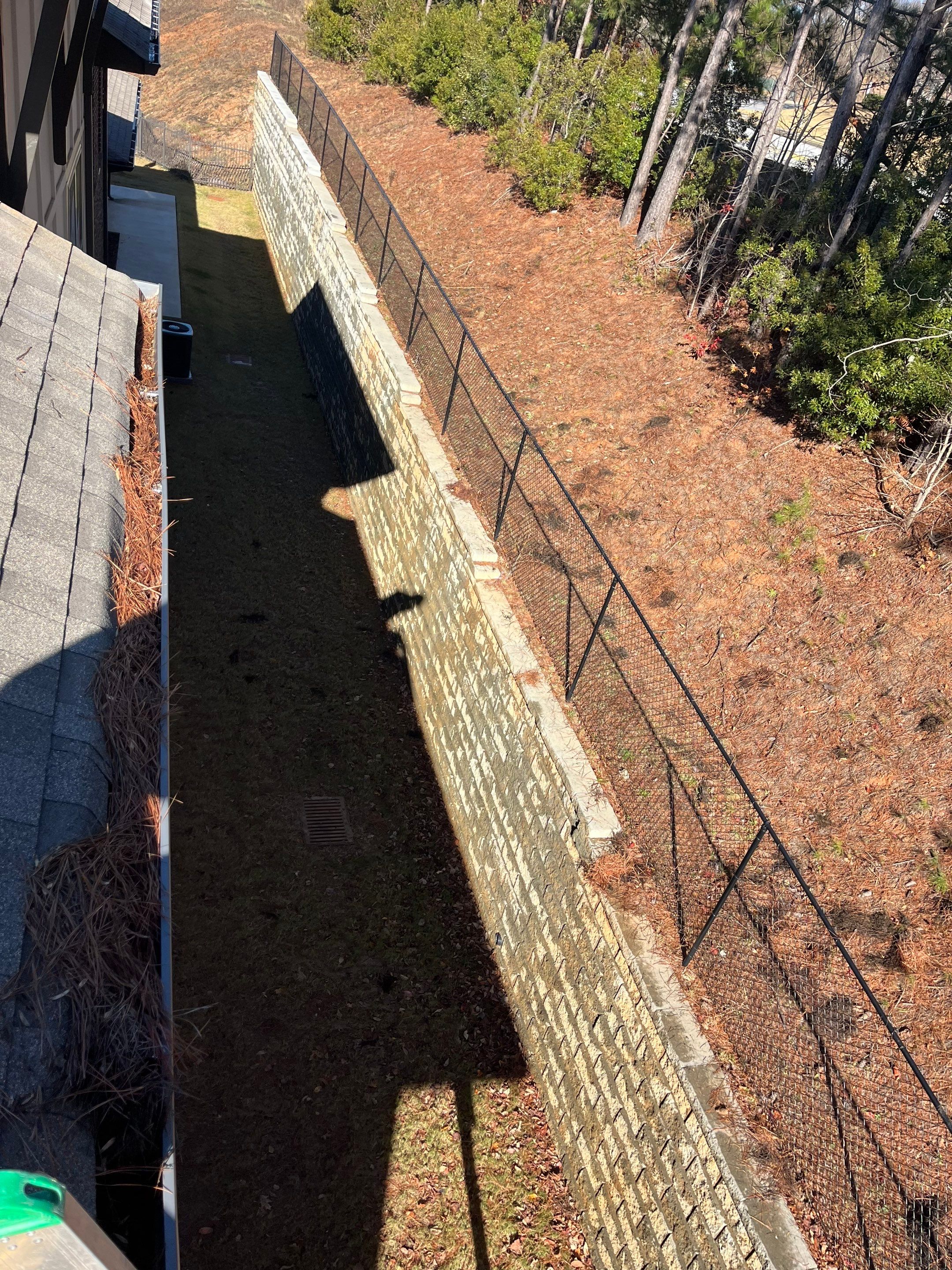 HOA gutter cleaning in Woodstock & Canton, GA,before  photo showing full gutters.