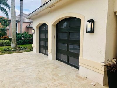 Modern Bronze Garage Door Installation With Frosted Glass in Boca Raton