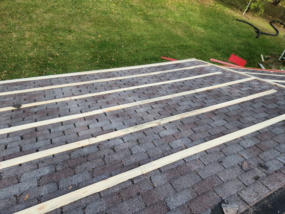 Residential Roof Installation with Red Pro Rib Metal Roofing in Adell, WI by Gellings Roofing & Siding