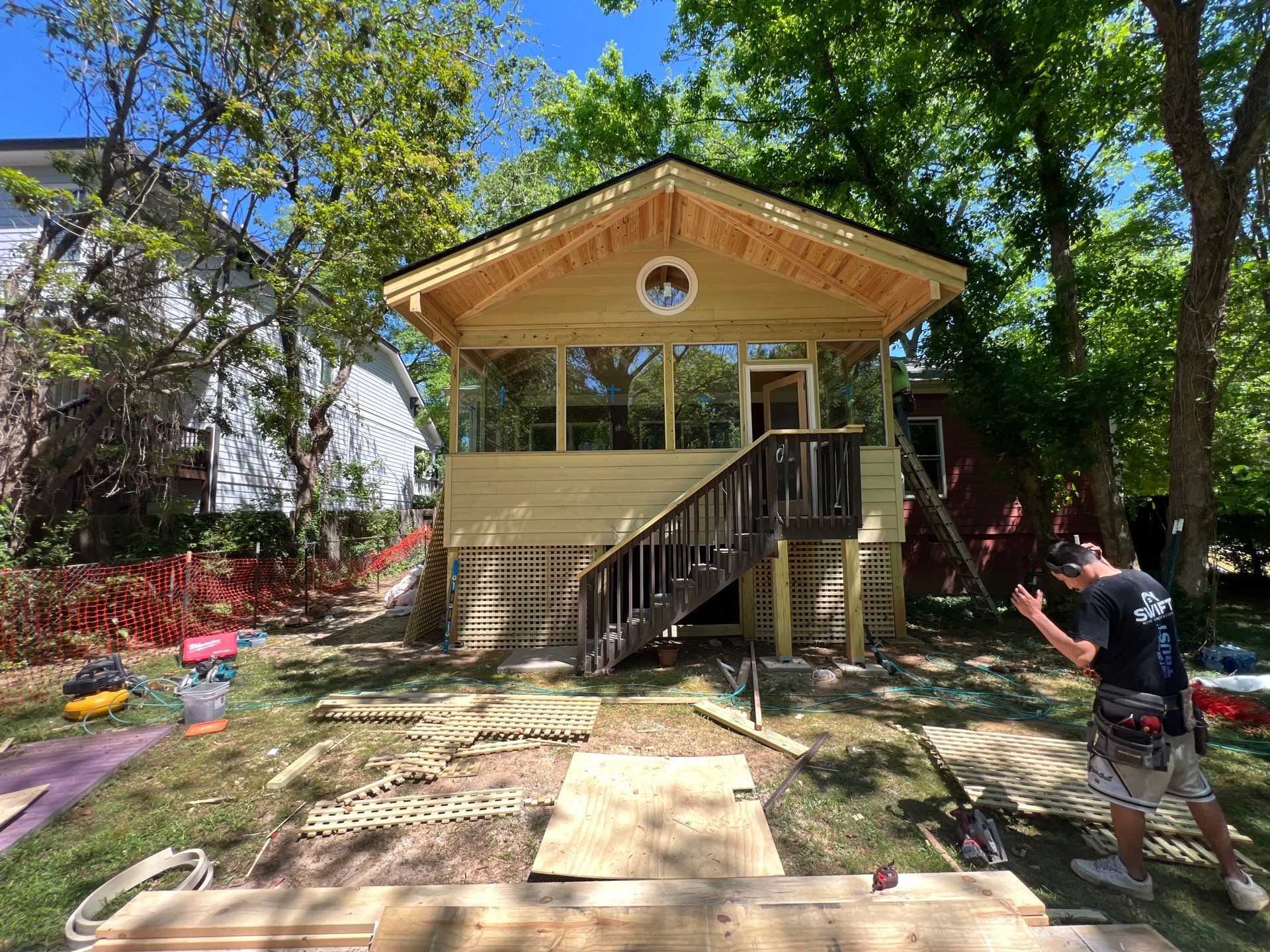 Elevated Screened-In Porch Addition with Vaulted Tongue-and-Groove Ceiling by Swift Home Renovations