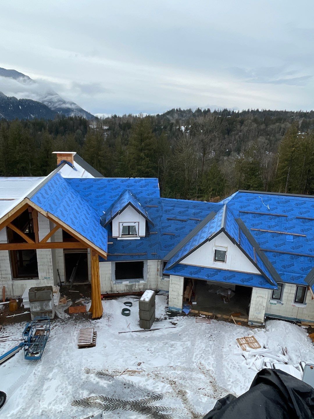 Residential Roofing Installation using 12" Prolok metal by Top Notch Roofing Inc