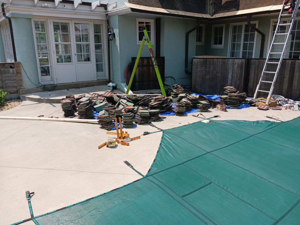 Slate removal/Cedar Shake replacement by Storm Contracting 