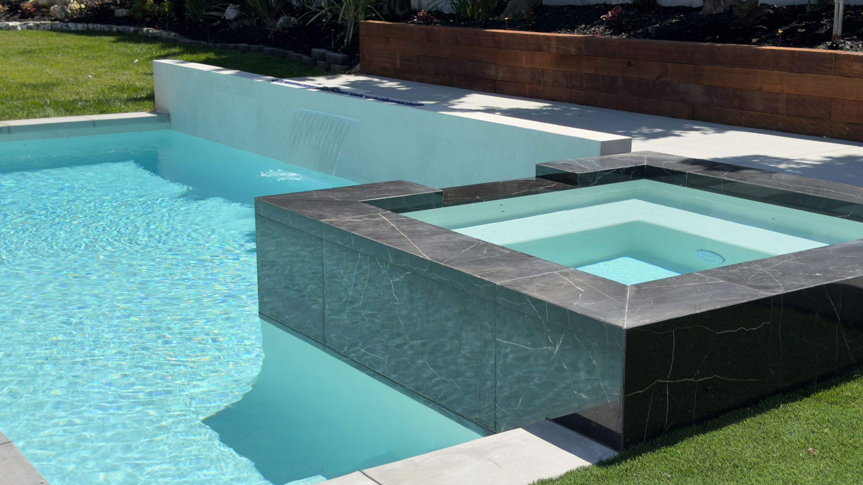 Pool With Raised Spa, Water/Fire Feature by Lax Home Inc 