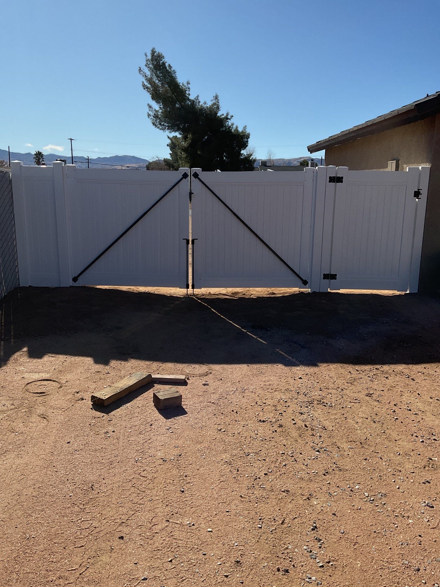 Gate installation using Vinyl by Fence Guys Inc. 
