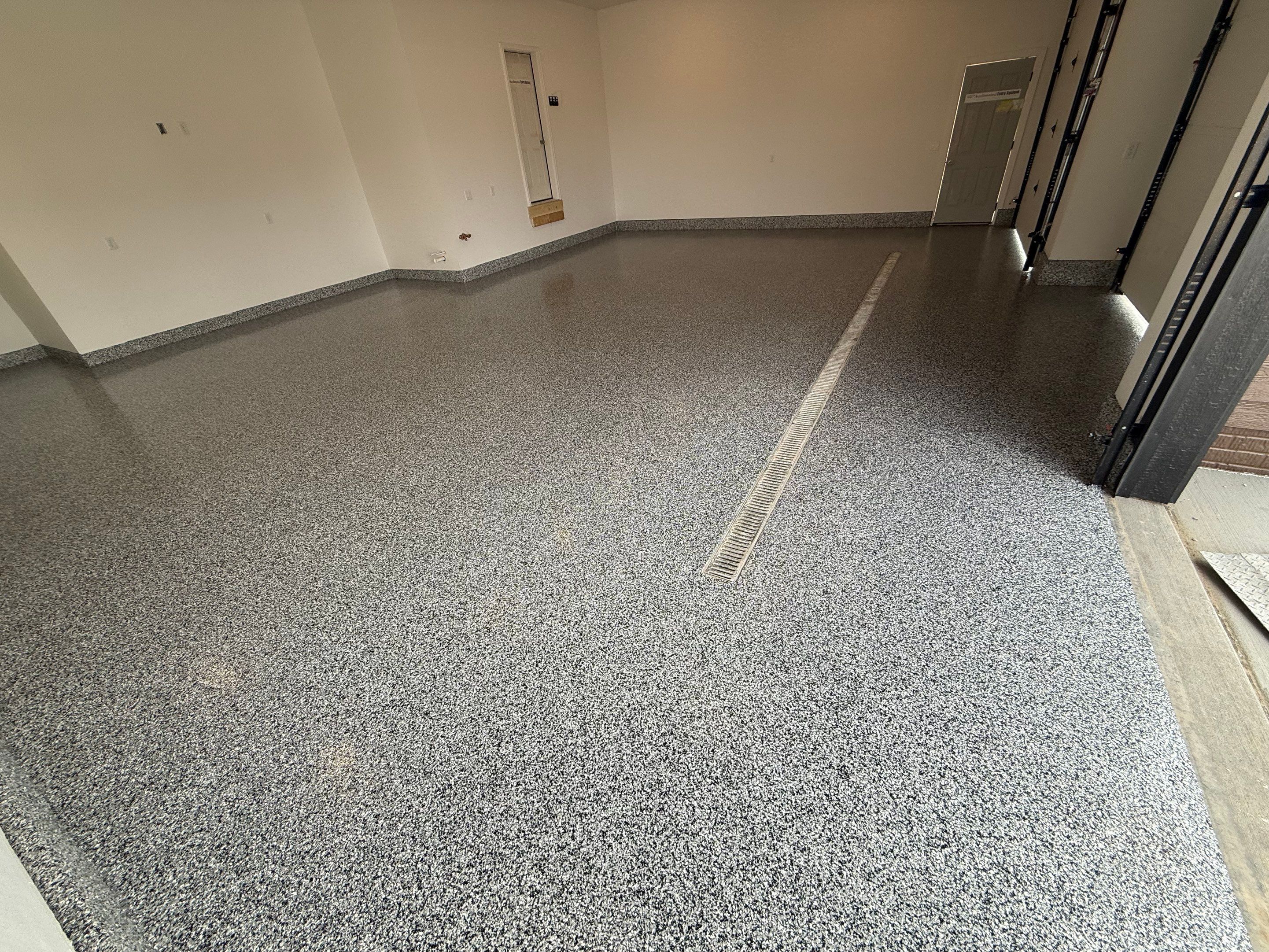 Multi-Car Garage Epoxy Floor Coating and Concrete Finishing in Sioux Falls by Select Painting, Coatings & Garage Cabinets