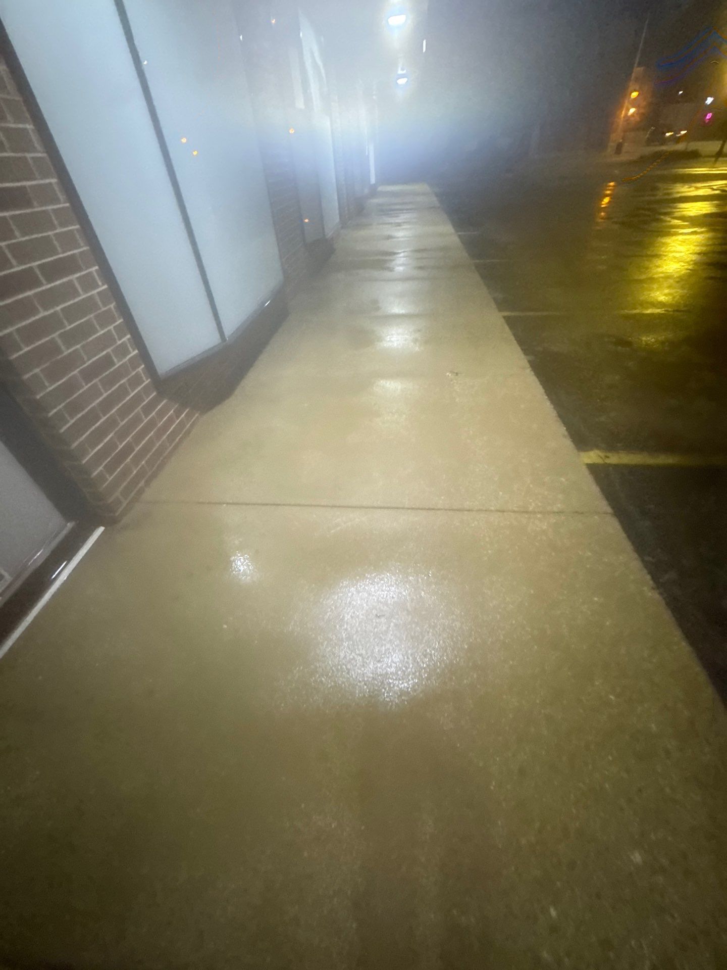 Commercial sidewalk cleaning. by Northern Power Washing LLC.