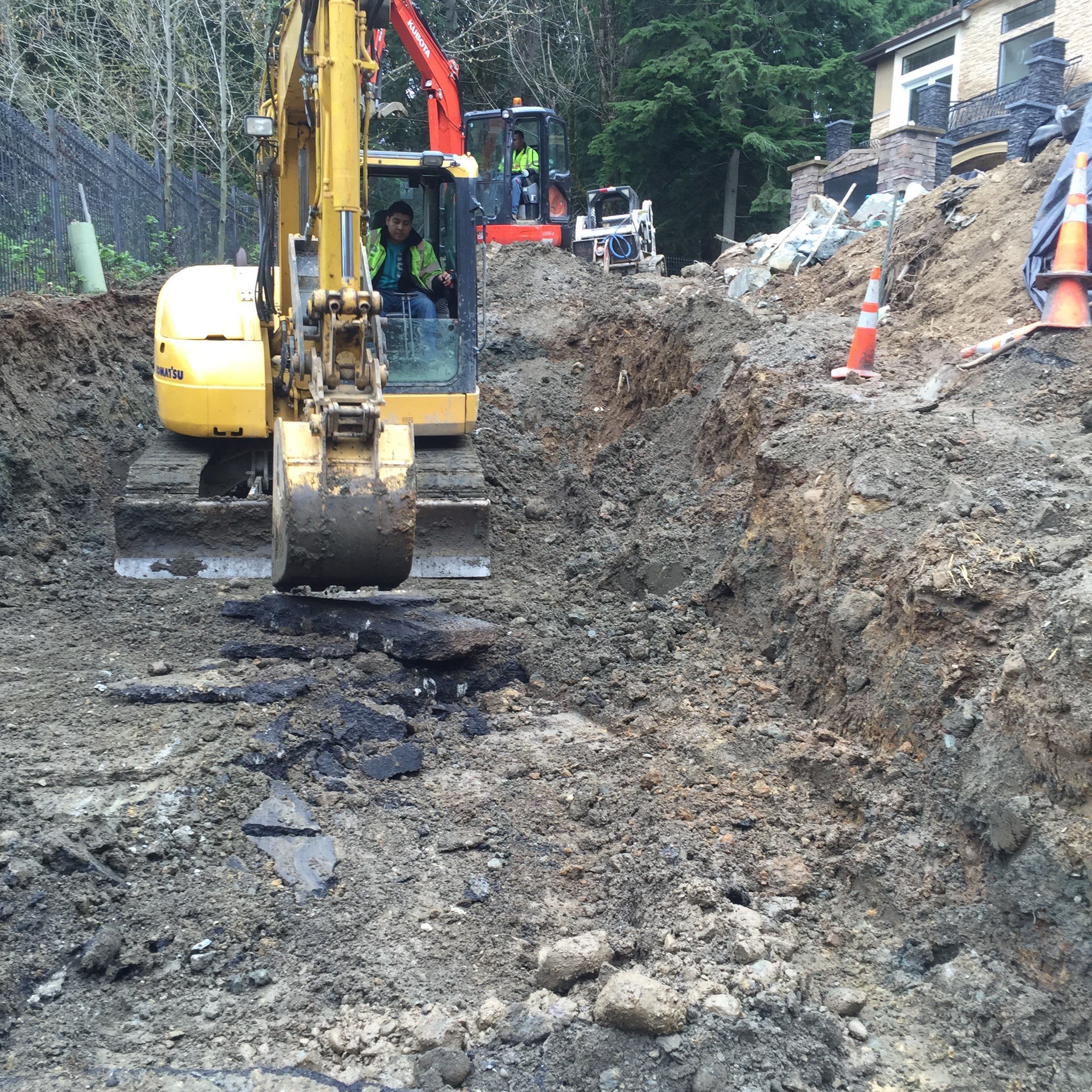 Asphalt Driveway and Stamped Concrete Patio Finish  by Jireh Asphalt & Concrete Inc 