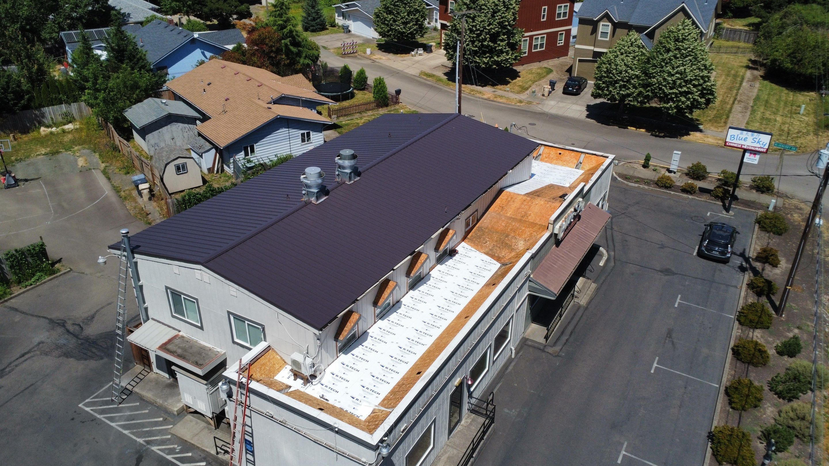 Commercial Flat Roof Installation using Bruce and Dana Snap Lock Metal (Color: Brown) by Orezona Building & Roofing Company, Inc.