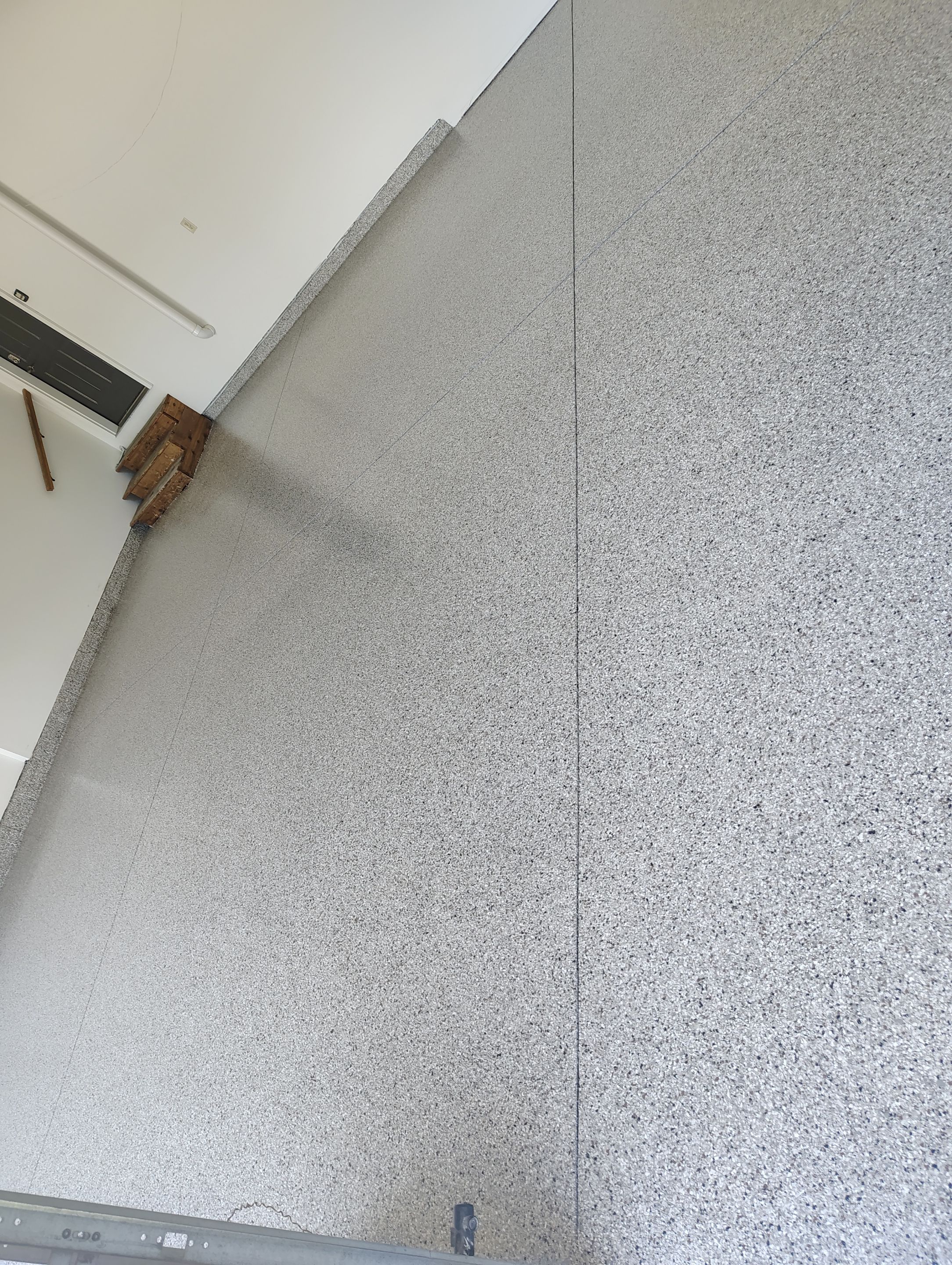 Custom Grey Speckled Epoxy Floor Coating for Sioux Falls Garage by Select Painting, Coatings & Garage Cabinets