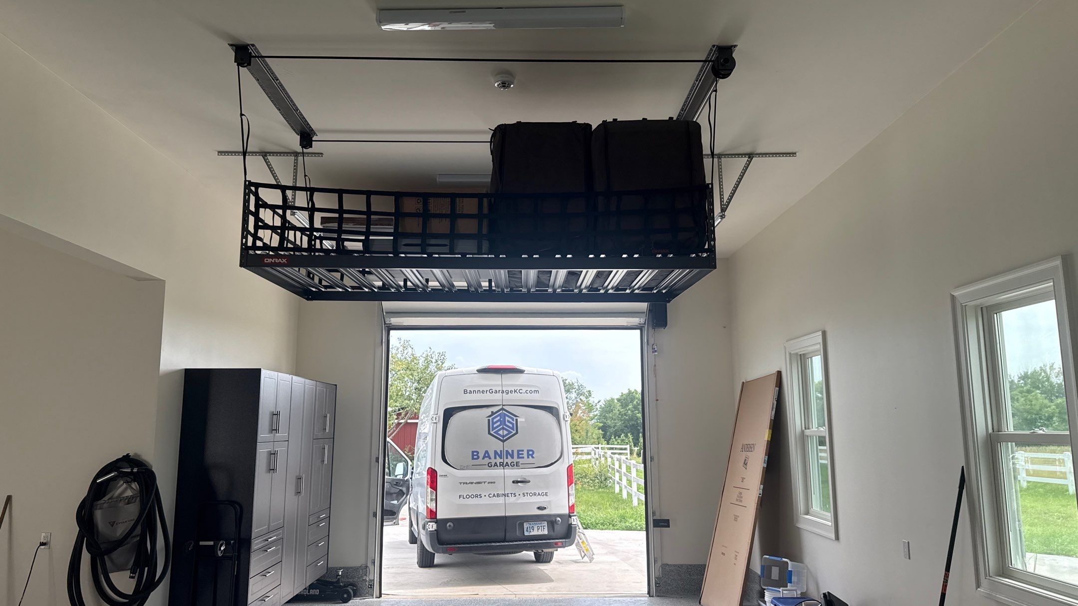 Mark Added Storage Plus A Motorized Lift  by Banner Garage