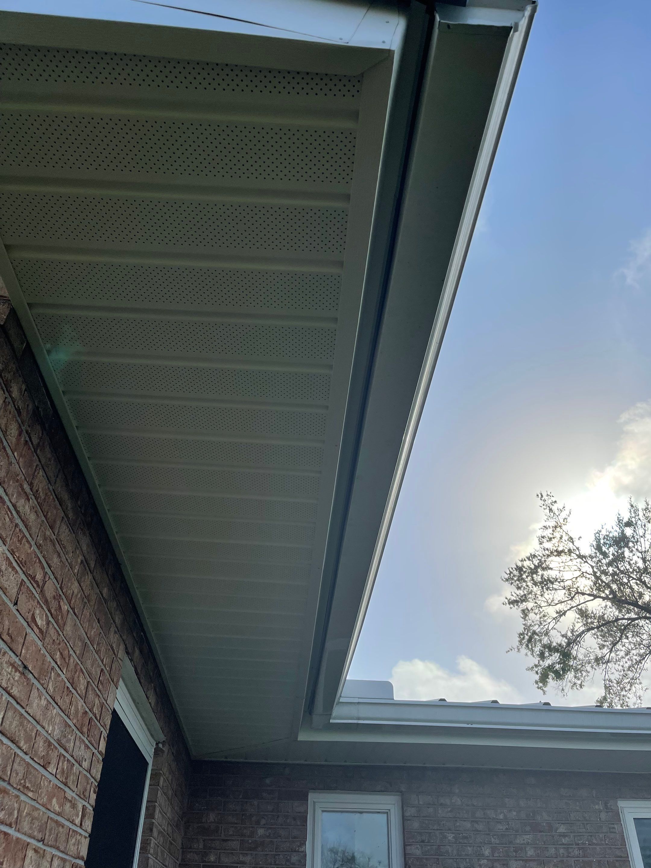 Soffit and Fascia Installation Using White Vinyl Soffit by Gutter Professors