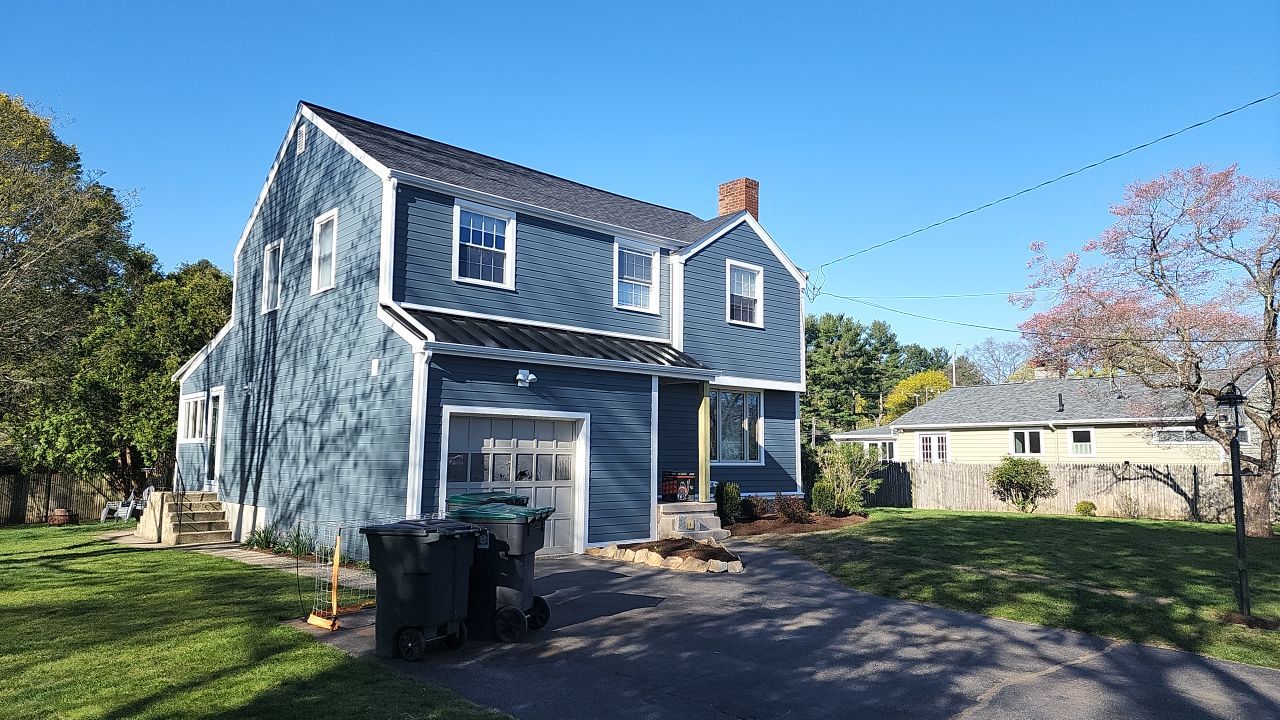 James Hardie siding, new metal roof and couple windows being installed. by UBrothers Construction