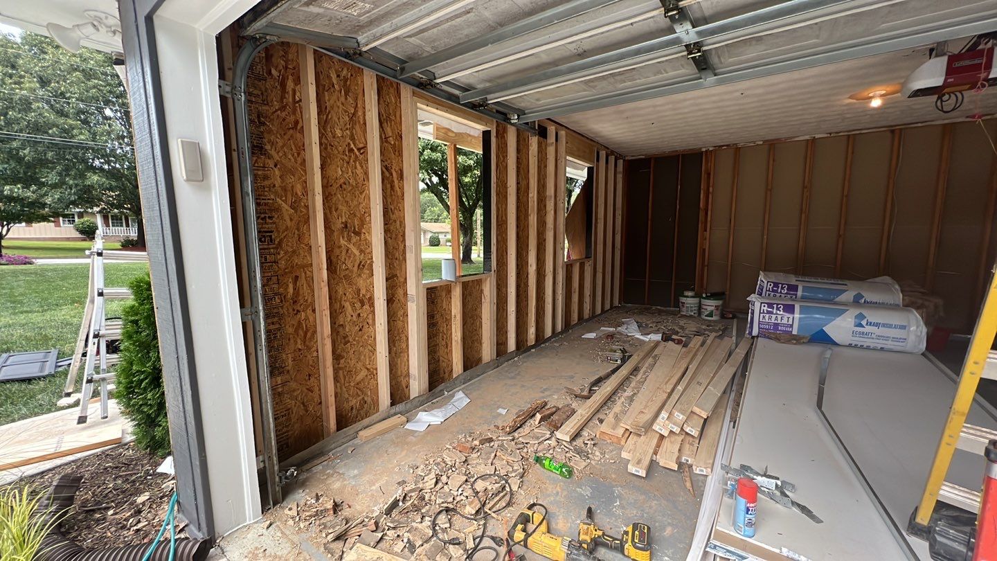 Snellville Garage Remodel Featuring Epoxy Floors and Board and Batten Siding by Swift Home Renovations