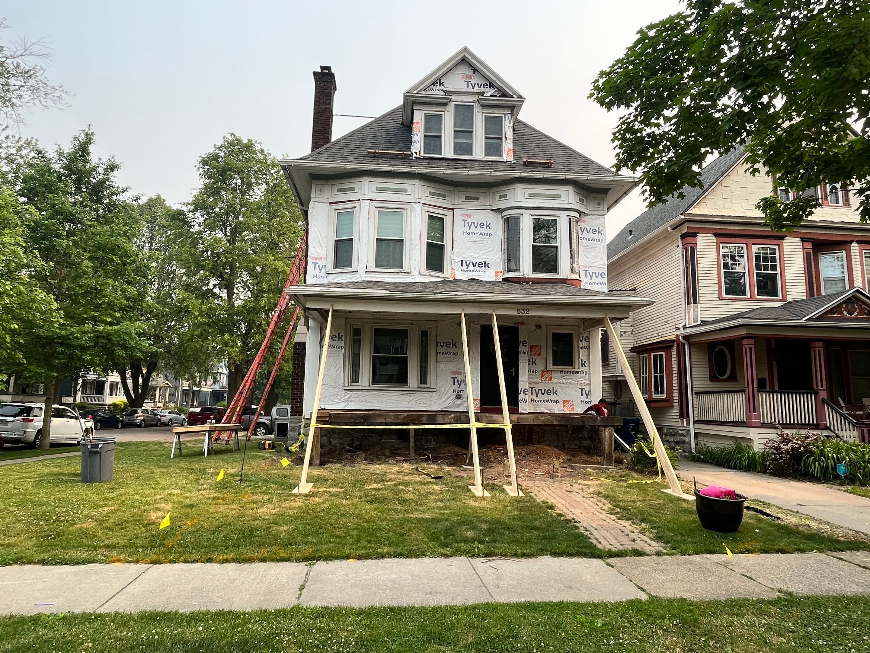 Exterior Renovations- Siding, Stamped Concrete, Porch, and Railings by Ivy Lea Construction