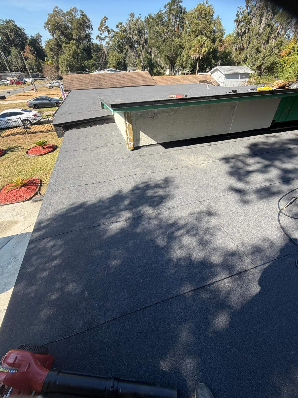 Flat Roof Renovation Due to Water Accumulation by urban green energy llc