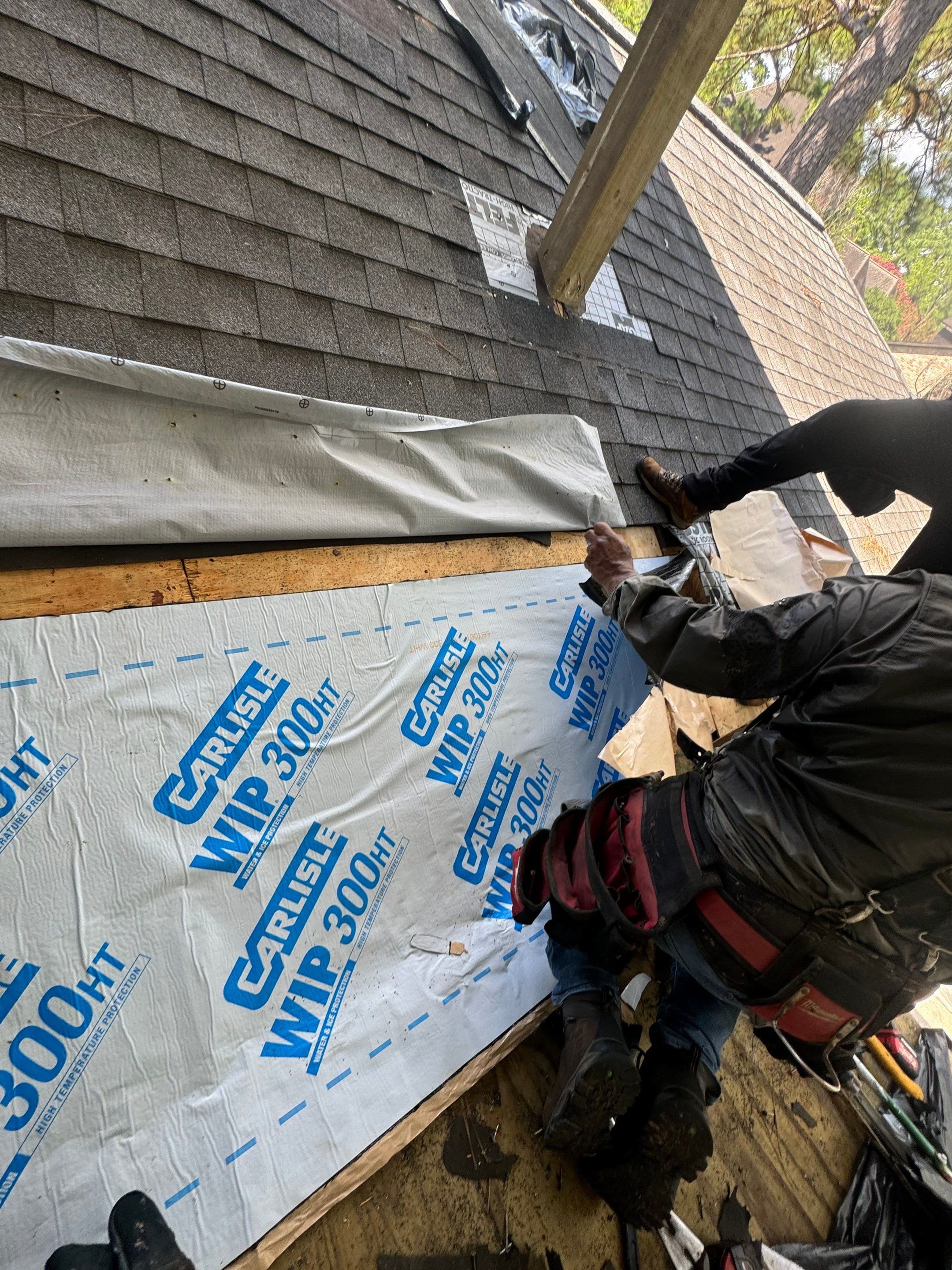 Roof Leak occurring at Sloped Roof-Flat Roof pitch break by Associates Roofing Unlimited 