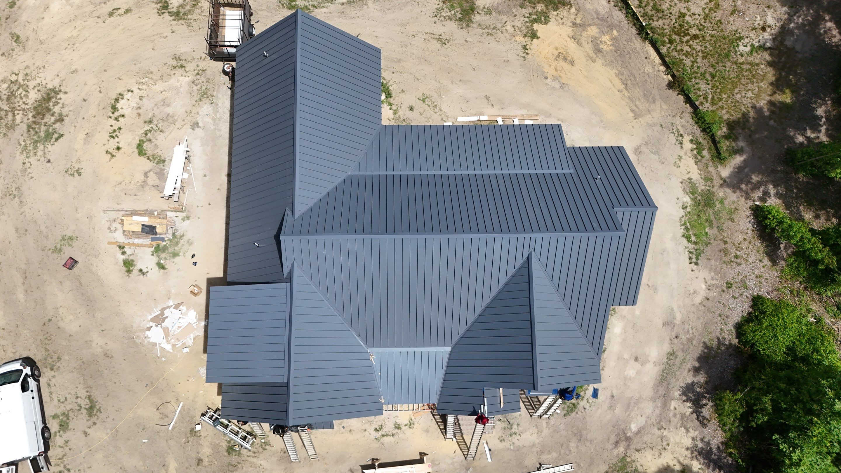 Custom New Construction Home Featuring Standing Seam Metal Roofing in Port Haywood by Cade Construction