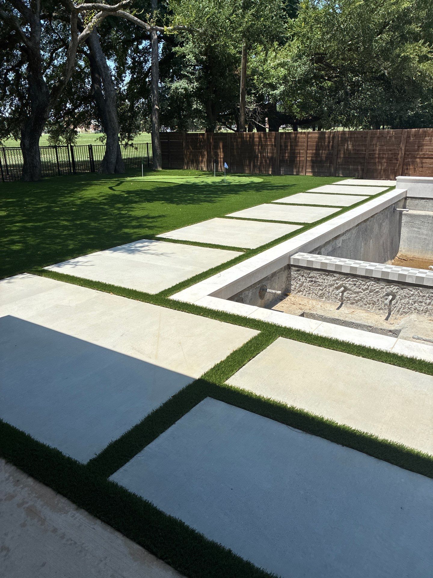 Modern Geometric Pool with Integrated Spa and Turf-Inlaid Decking by Pinnacle Pools and Spas - DFW