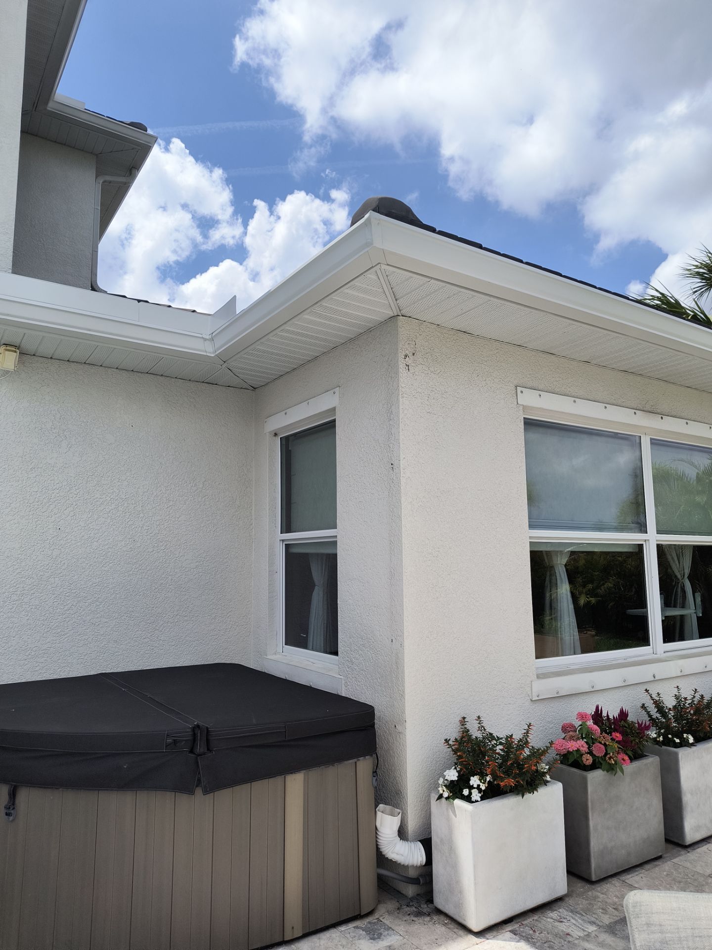 White Seamless Gutters with Downspouts in Bradenton FL by Gutter Professors