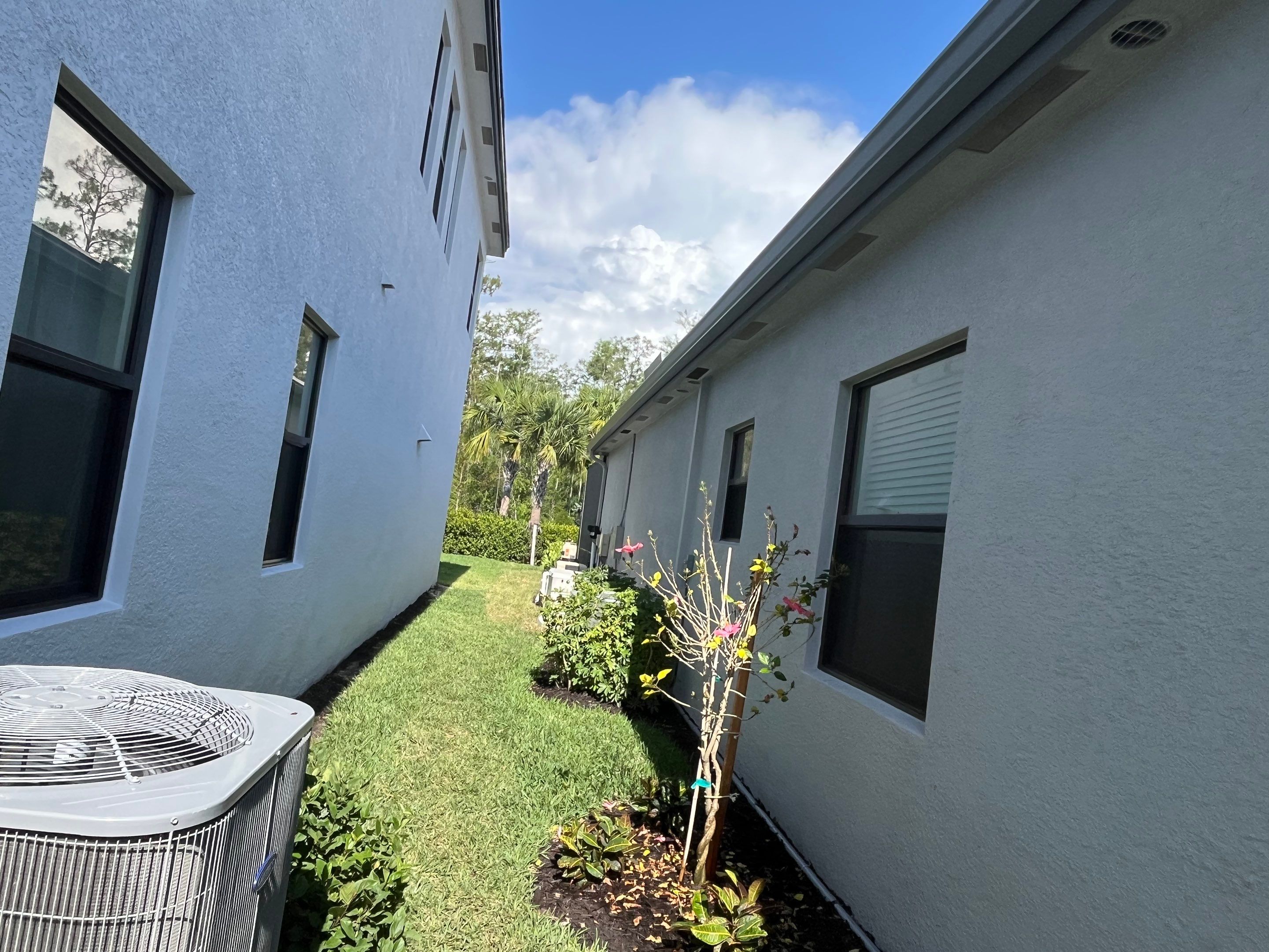 Grey Seamless Gutter Installation in Estero FL by Gutter Professors
