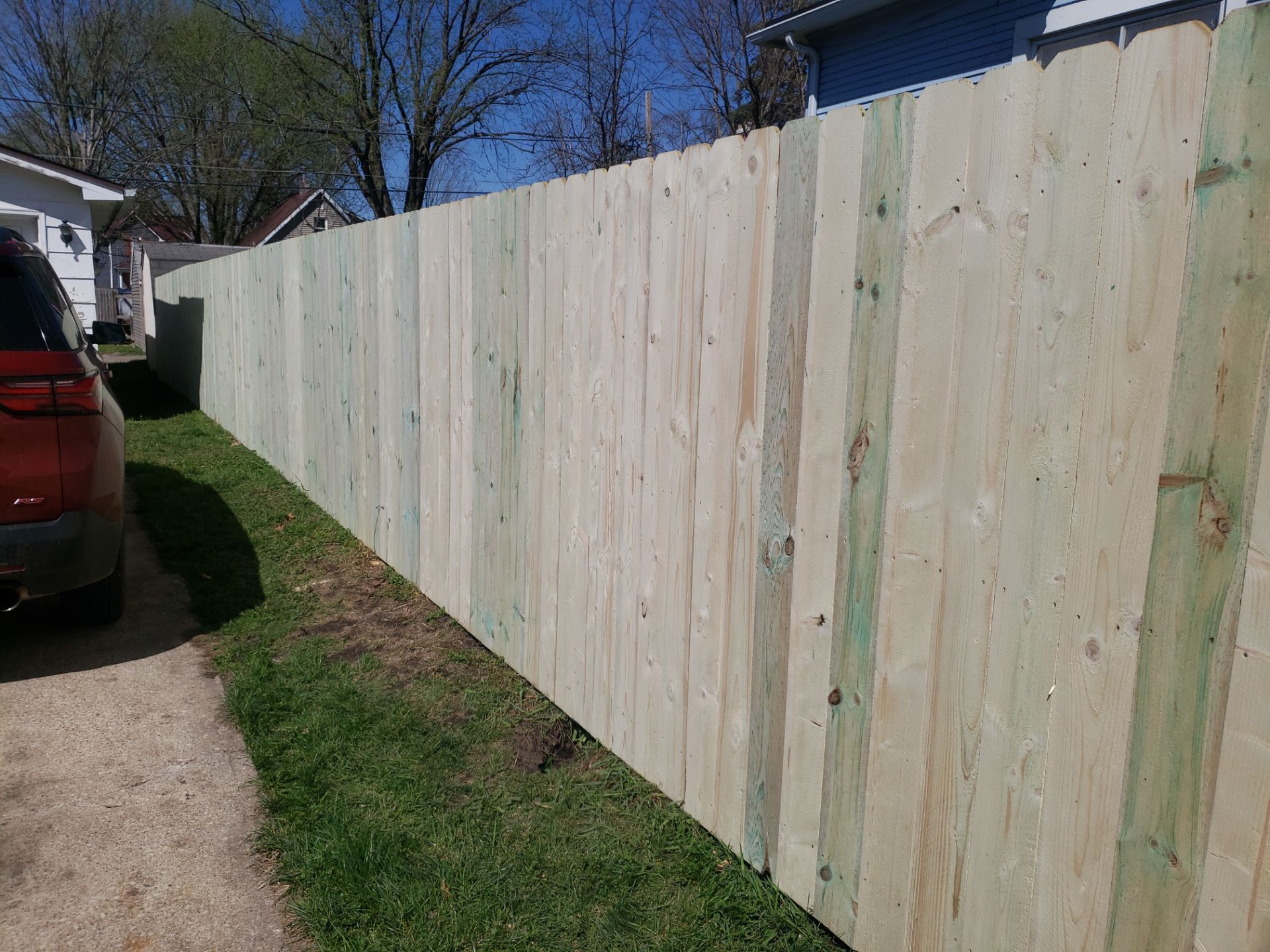 Pressure-Treated Wood Privacy Fence Replacement in Waterloo by Perfect Picket Fence and Stain