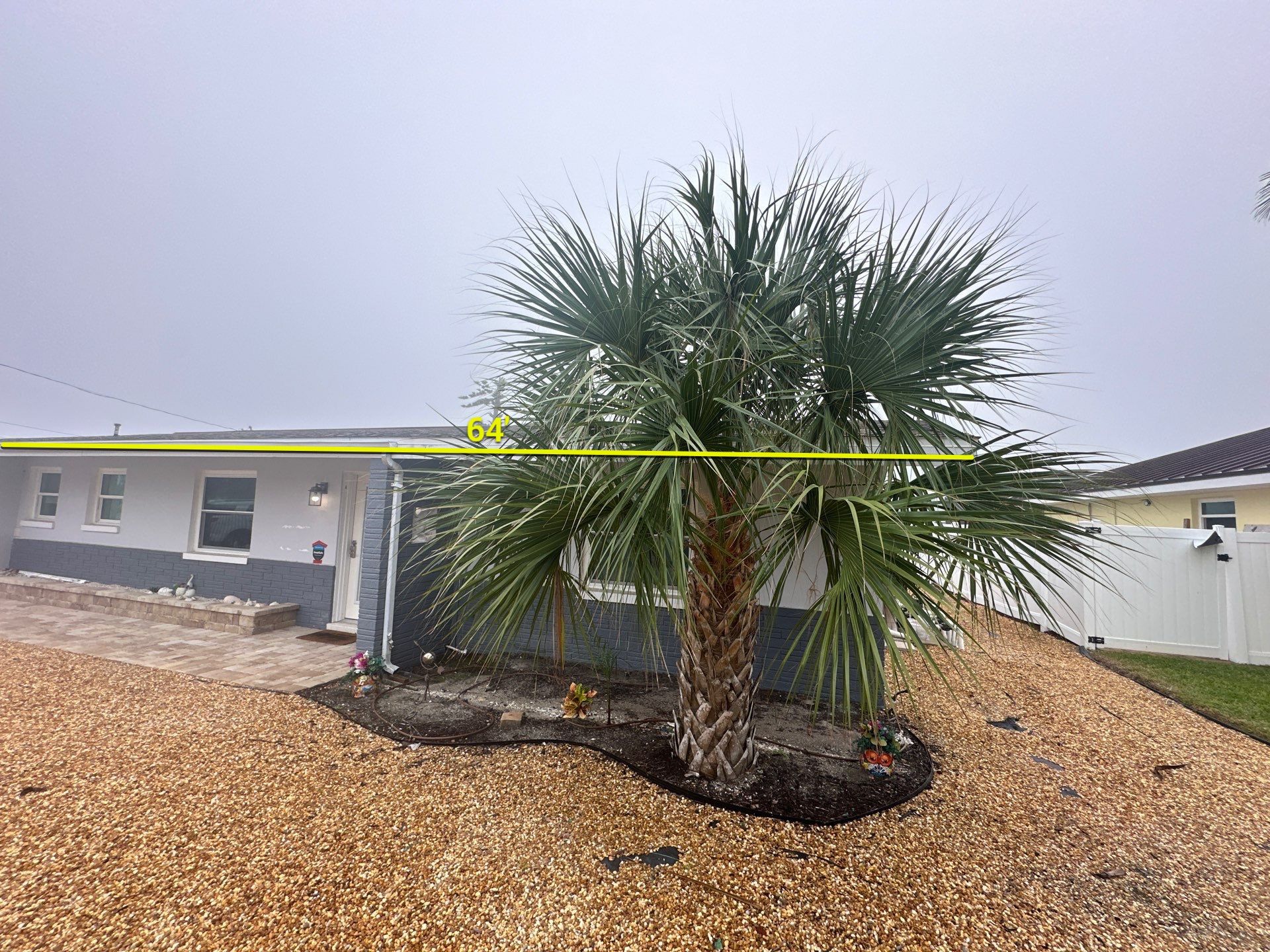 White Seamless Gutters with Matching Downspouts in Fort Myers Beach FL by Gutter Professors