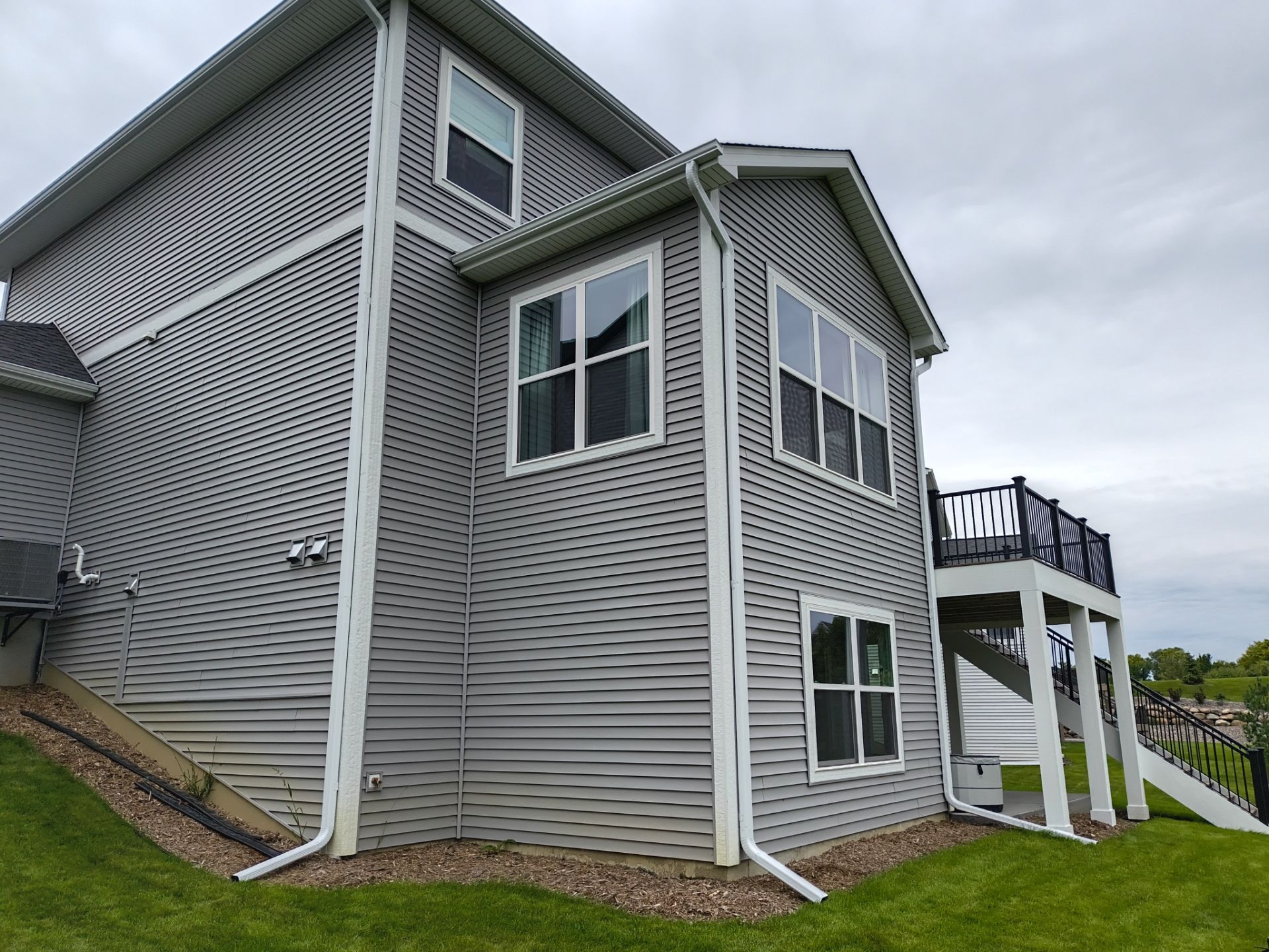 5-Inch Seamless Gutter Installation – 3-Story Home in Dayton, MN by Next Level Seamless Gutters / Exteriors Inc.