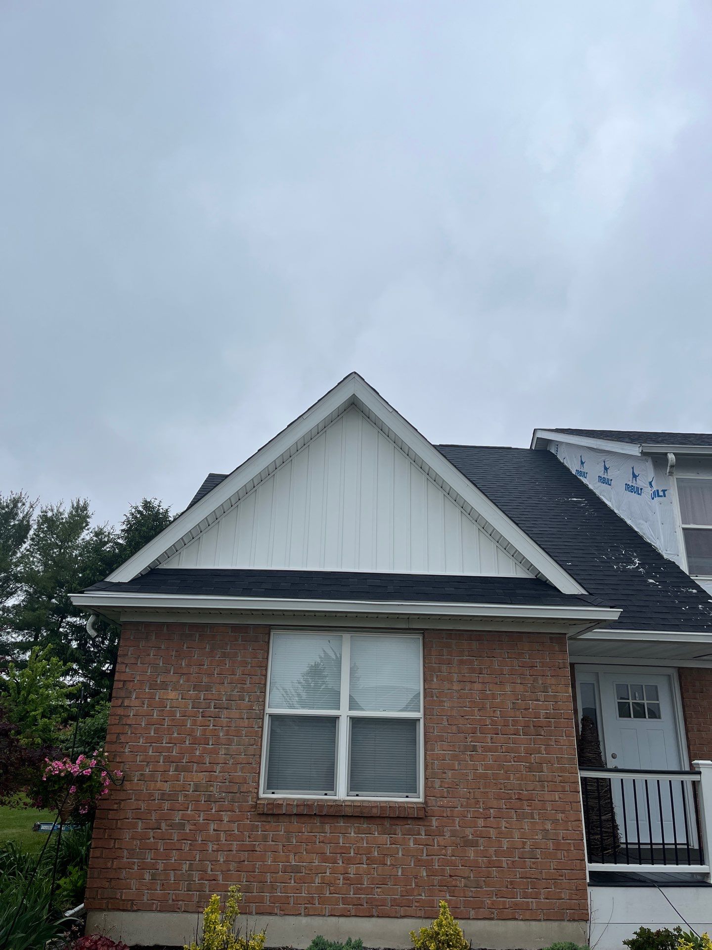 Exterior Installation using Onyx Black Durations and White Siding by WIW Enterprises Inc