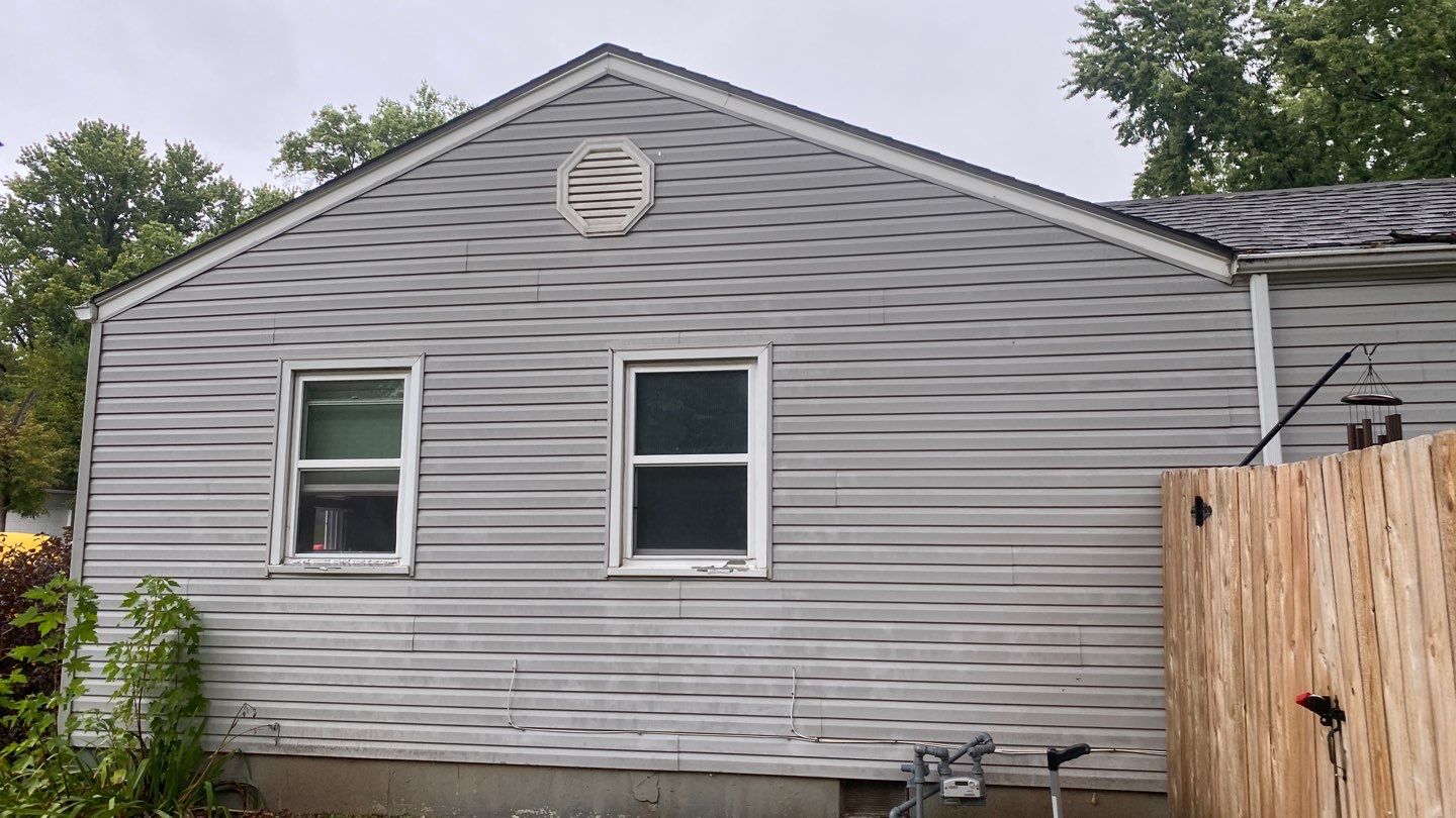 A whole new look for this Gladstone Home  by EEC  Windows, Siding & Roofing 