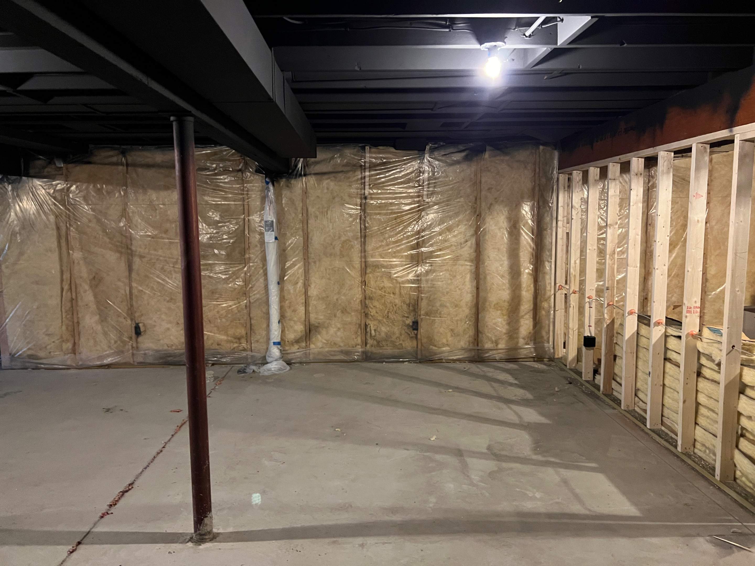 Basement Remodel w/ LVP Flooring & Exposed Ceiling by Chagnon Building & Remodeling LLC