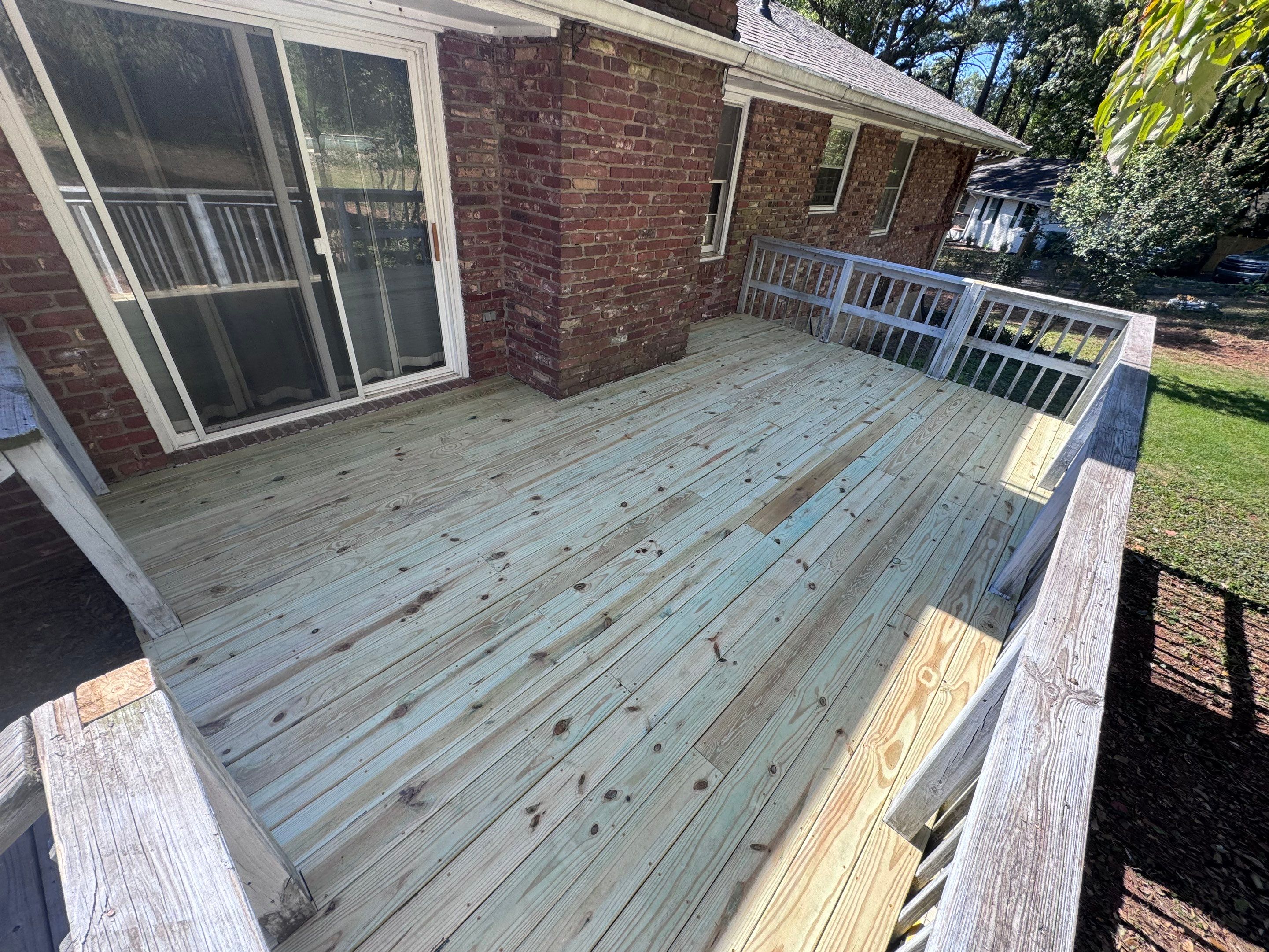 Pressure-Treated Wood Deck Replacement and Railing Installation in Marietta by Swift Home Renovations 