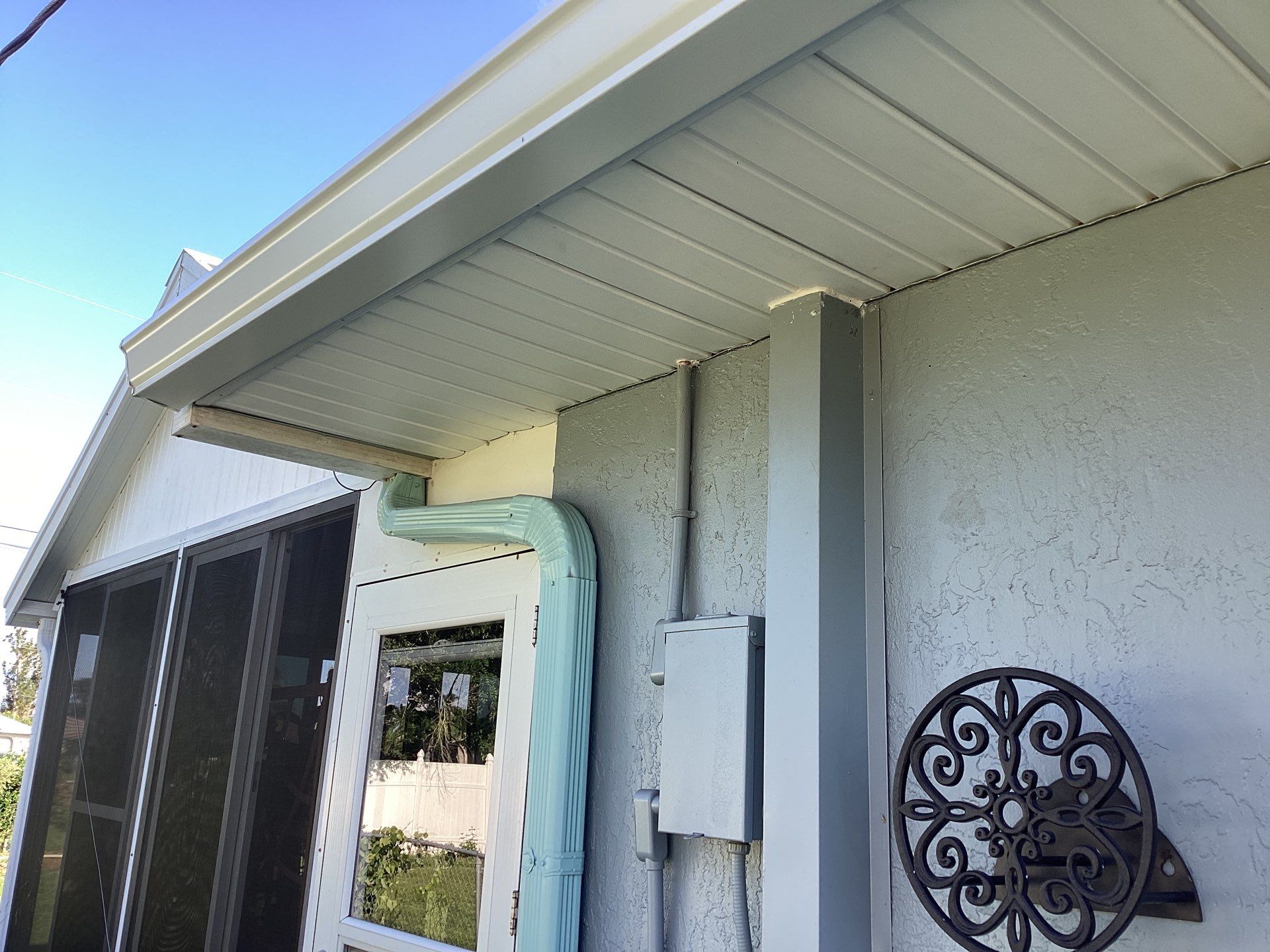 Soffit and Fascia Installation using White Vinyl Soffit in Cape Coral FL by Gutter Professors