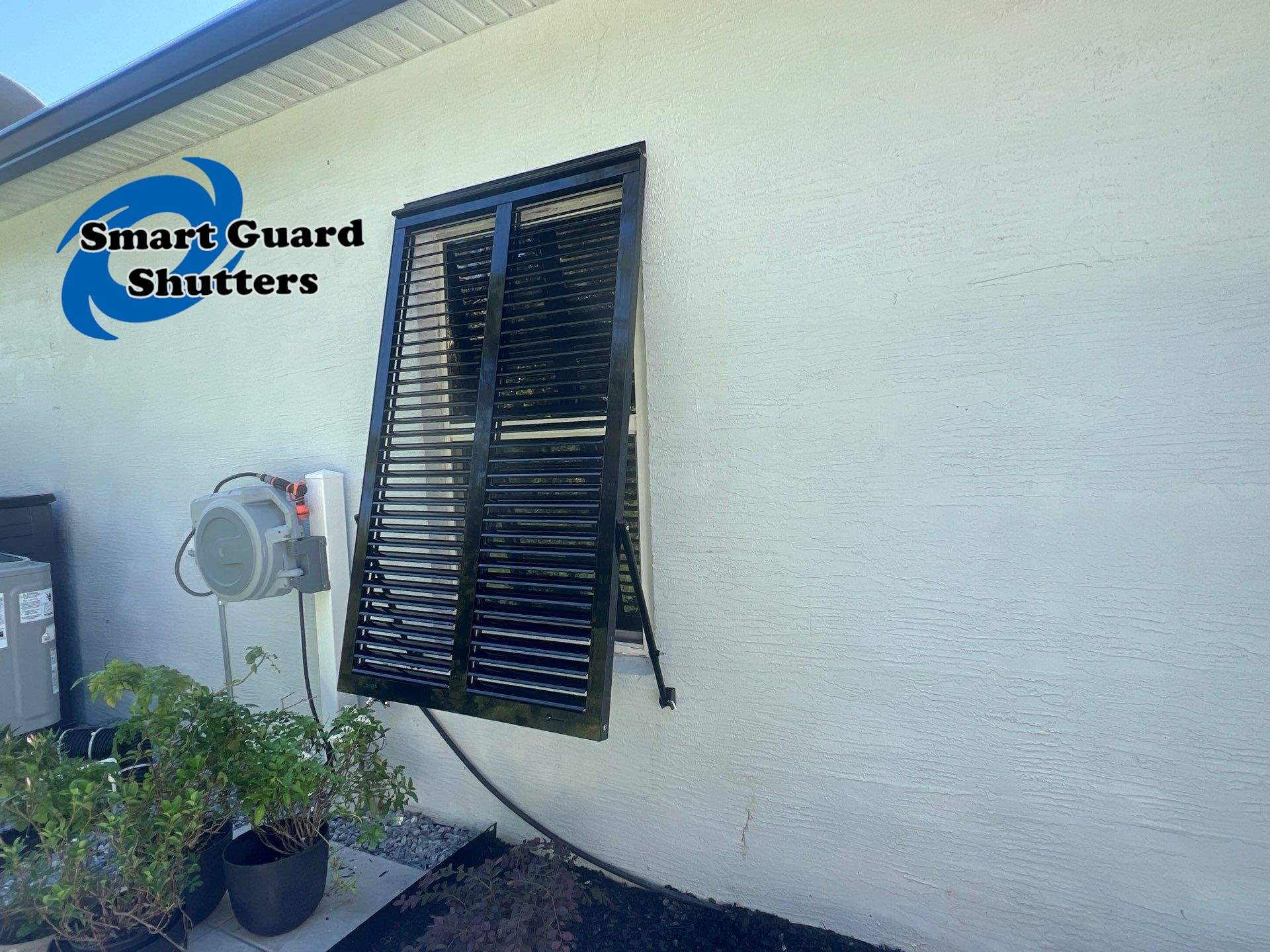 Impact Bahama Shutters in Jet Black by Smart Guard Shutters